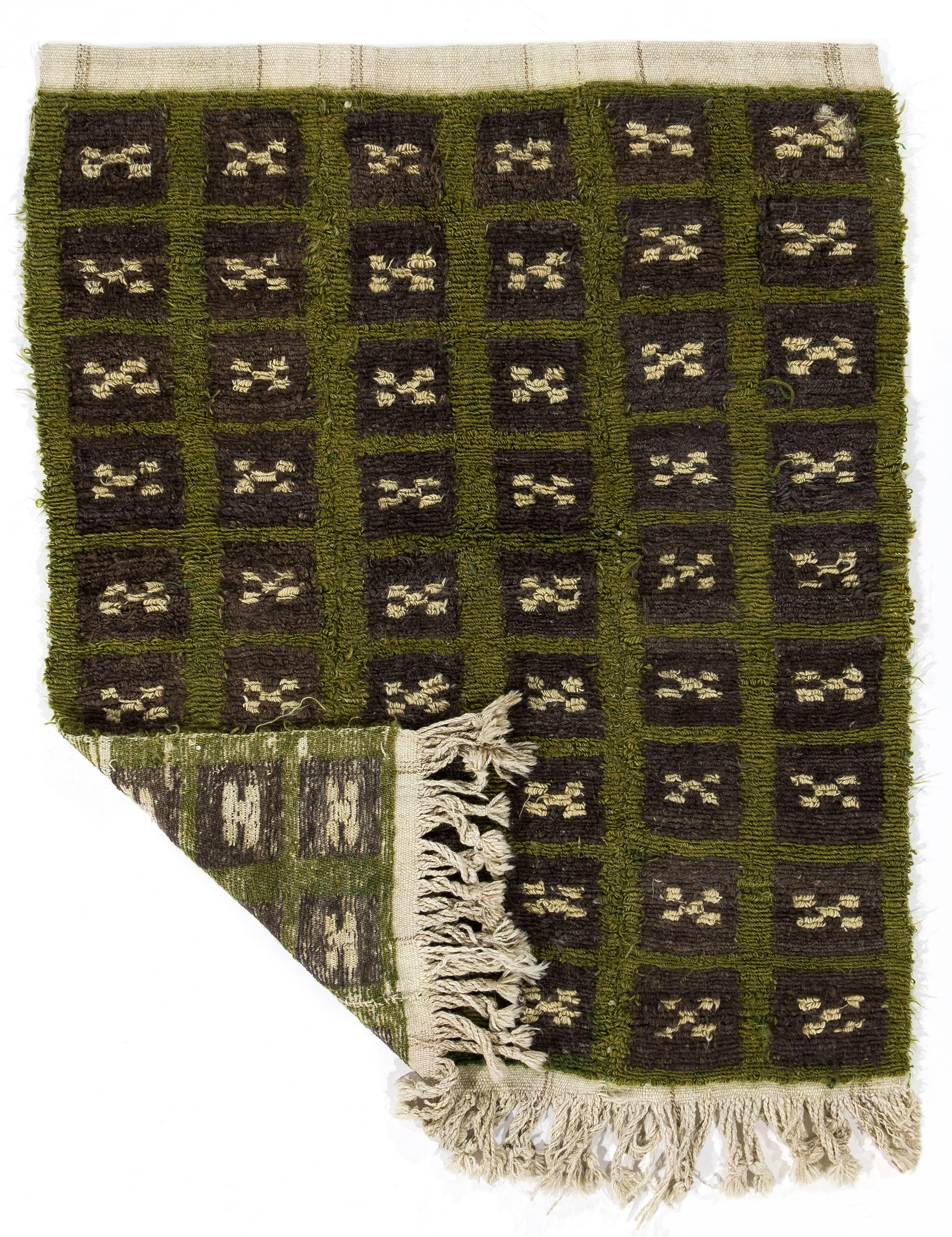 A vintage hand-knotted "Tulu" (Turkish word for "long piled") rug from Konya in Central Anatolia, Turkey.
These charming small rugs with simple modern designs and long lustrous wool pile were produced for daily use by villagers