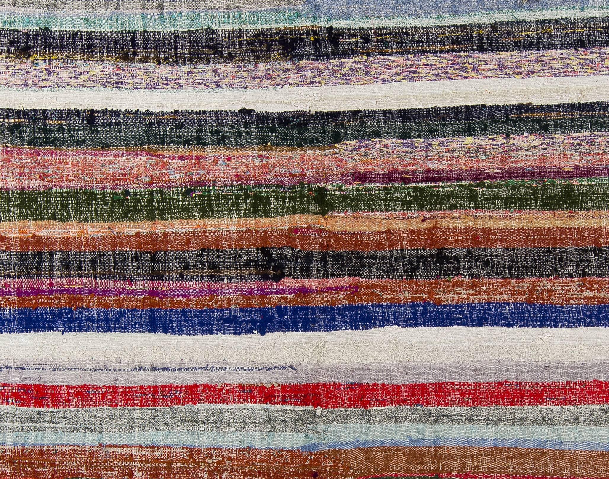 A colorful cotton rag rug handwoven in Eastern Turkey, circa mid-20th century. Very good condition, sturdy and clean, could handle everyday traffic.