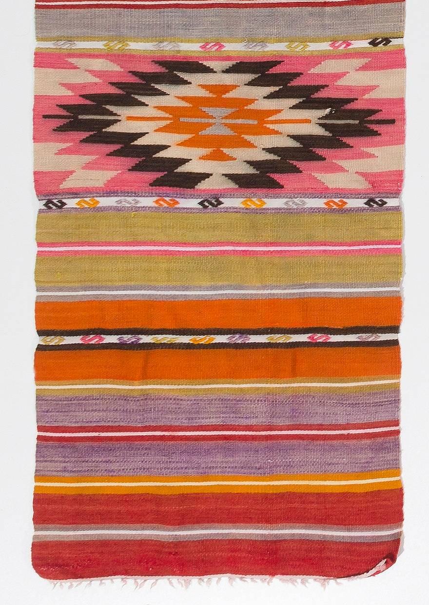 A colorful wool runner hand-woven by the nomadic tribes in south central Turkey. Very good condition, sturdy and clean.