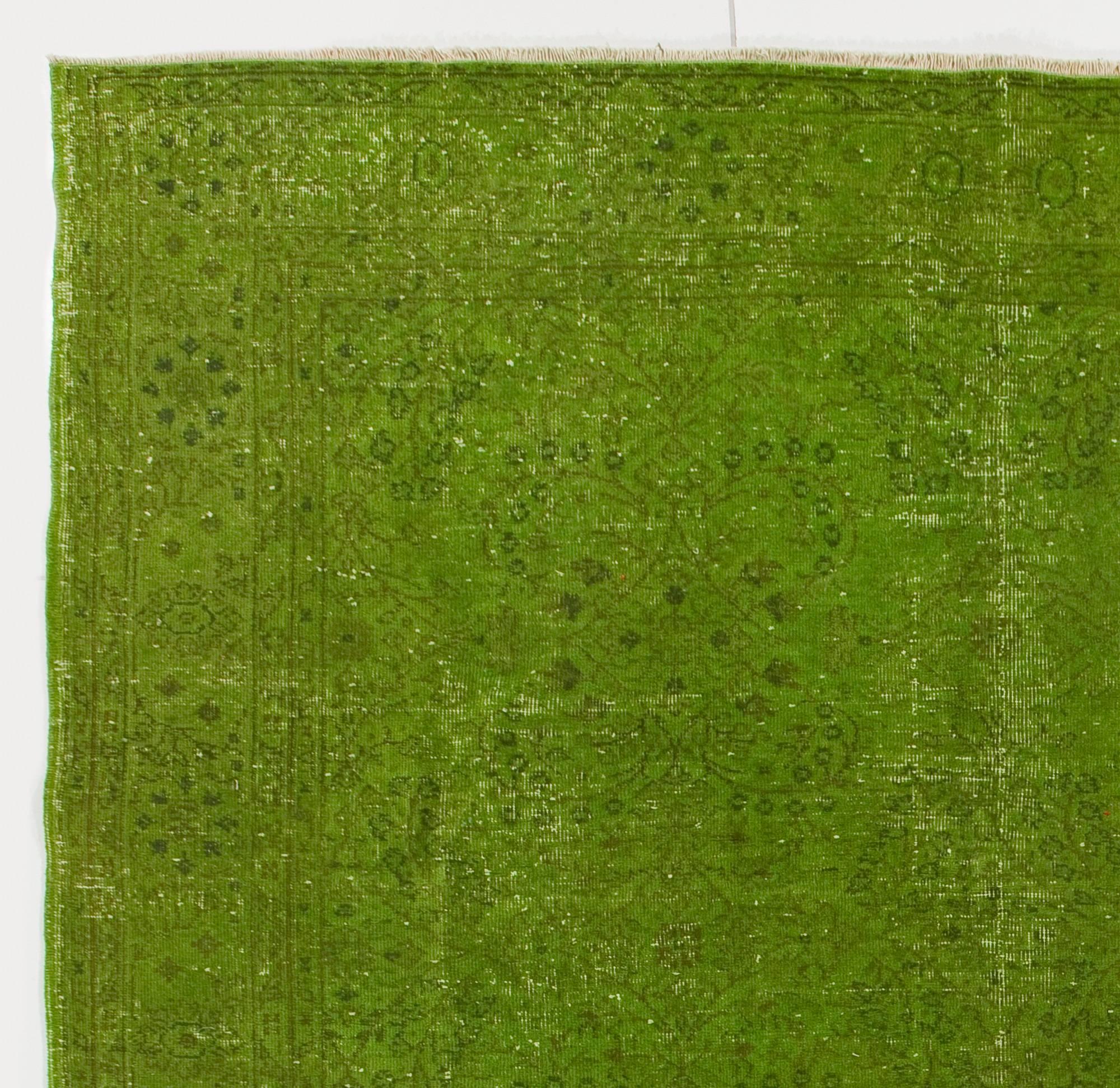 A Mid-Century handmade Turkish rug over-dyed in green color.
Finely hand-knotted, distressed look with low wool pile on thick cotton foundation. Sturdy and as clean as a brand new rug.