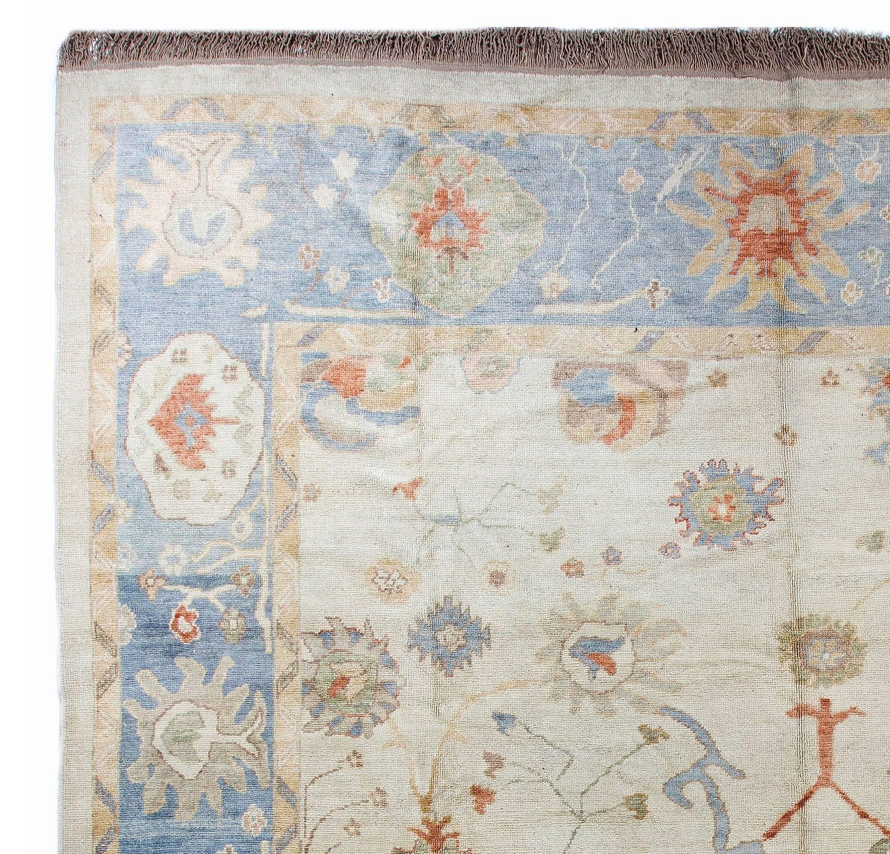 An antique inspired and look hand-knotted Oushak carpet made with lustrous hand-spun sheep wool.

Size: 12'6