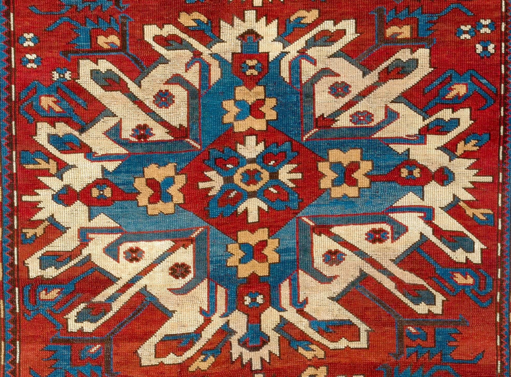 An antique Caucasian rug from the village of Chelaberd in Southern Karabagh. This highly popular so called Sunburst or Eagle Kazak design rugs are some of the most collectible and sought after ones among all antique Caucasian works of textile