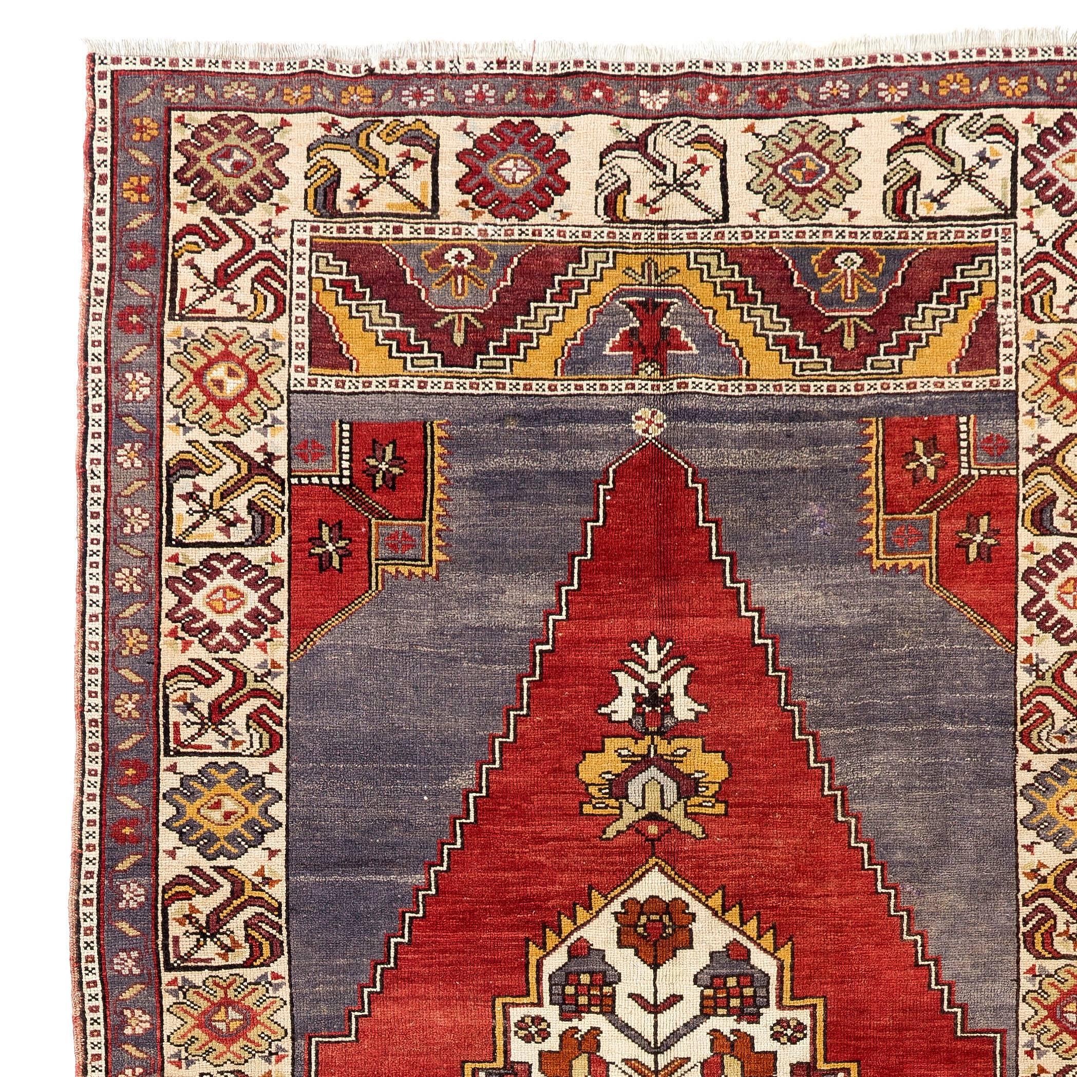 A vintage hand-knotted traditional village rug from Central Turkey. 100% soft lustrous wool.