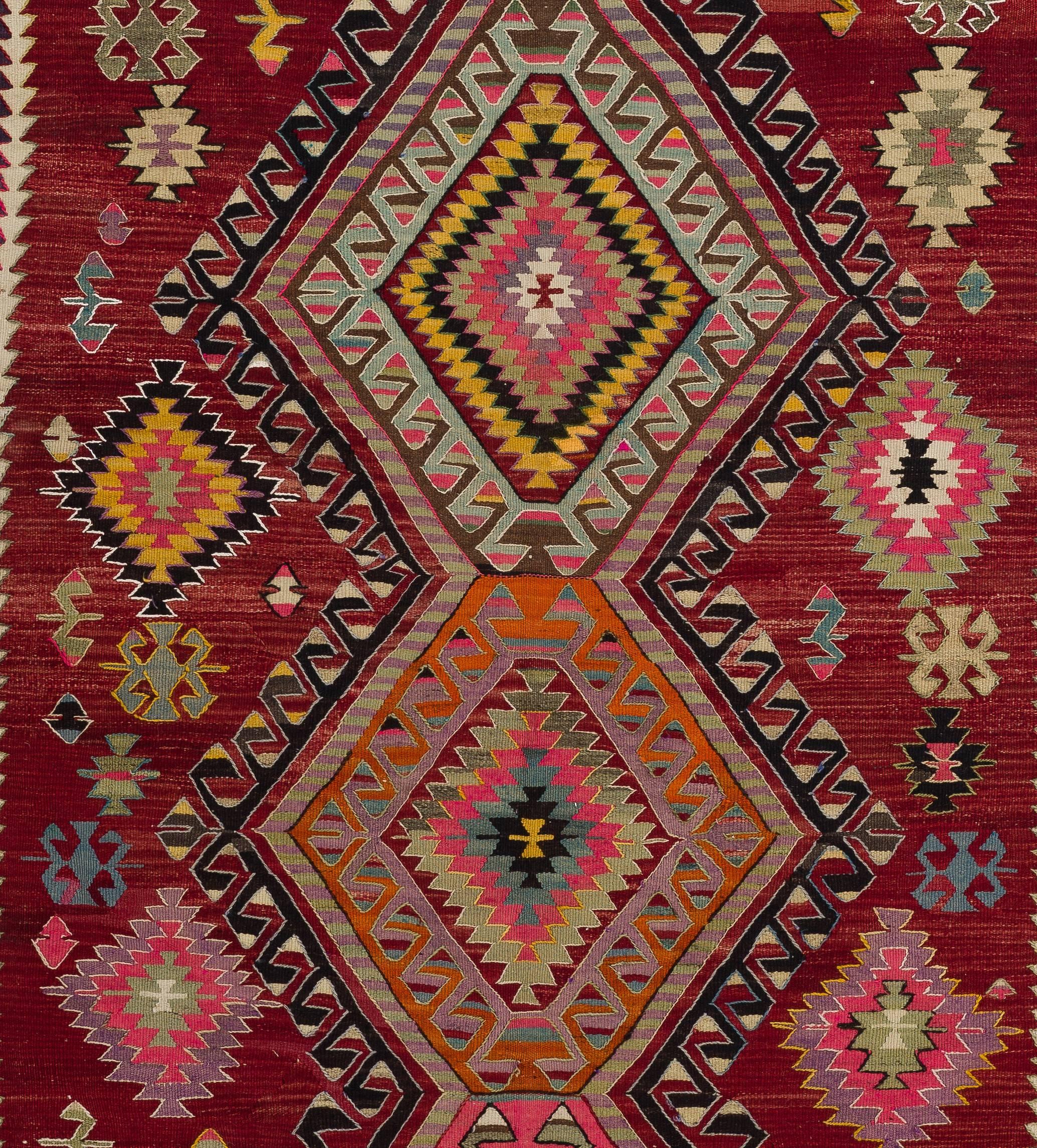 A colorful Turkish Kilim (flat-woven rug) in excellent original condition. It is finely handwoven in naturally dyed wool.
