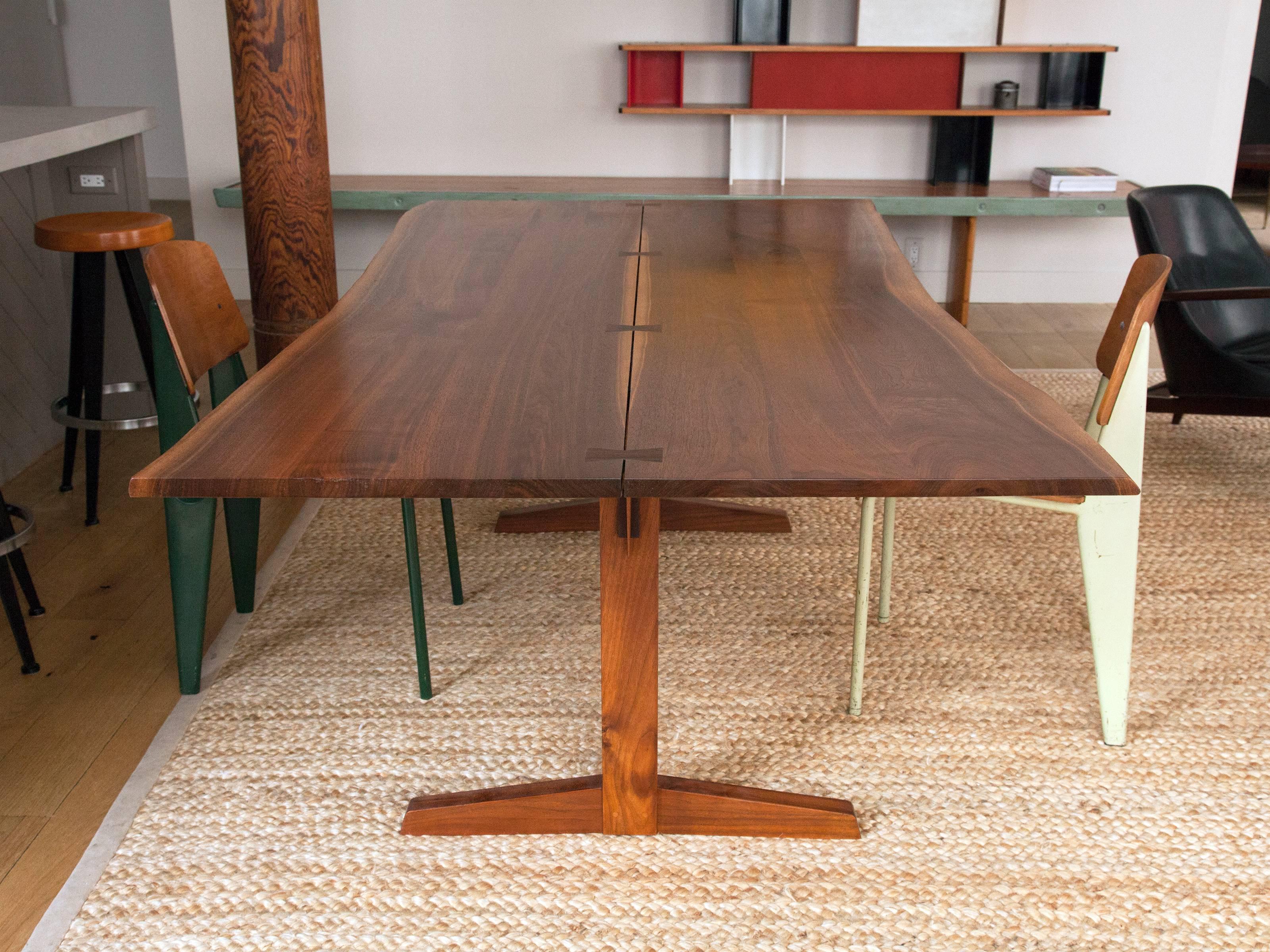 Walnut George Nakashima Trestle dining table with four rosewood butterfly joints and two free-form edges along length. Provenance: Private collection, acquired from Christie's, 1997