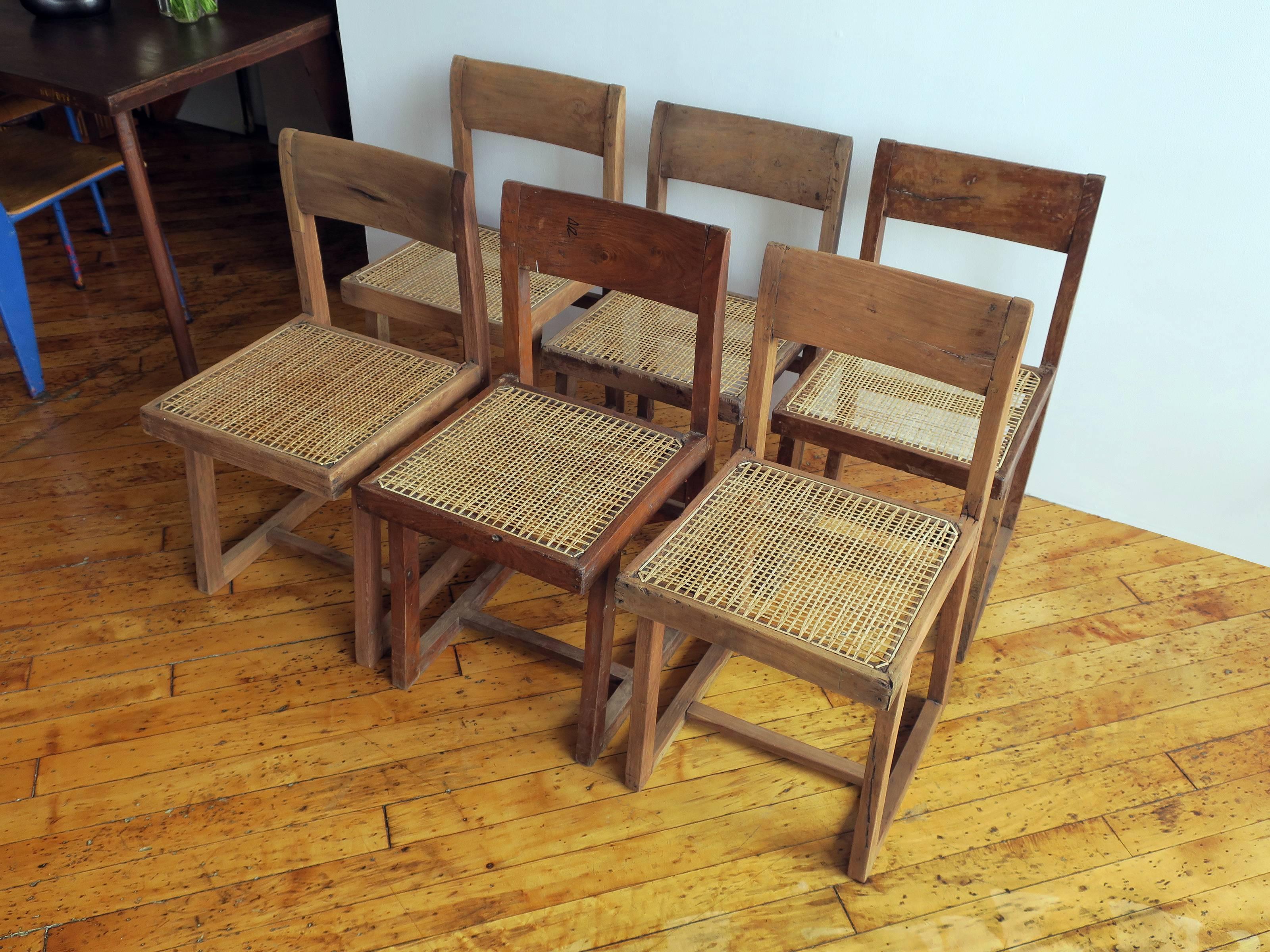 A very rare set of six “Box” frame chairs, Model No.PJ-SI-54-A from Punjab University, Chandigarh, India, in original condition. The chair frames were washed, not re-stained, and newly caned to preserve the history of the pieces. Chairs can be waxed