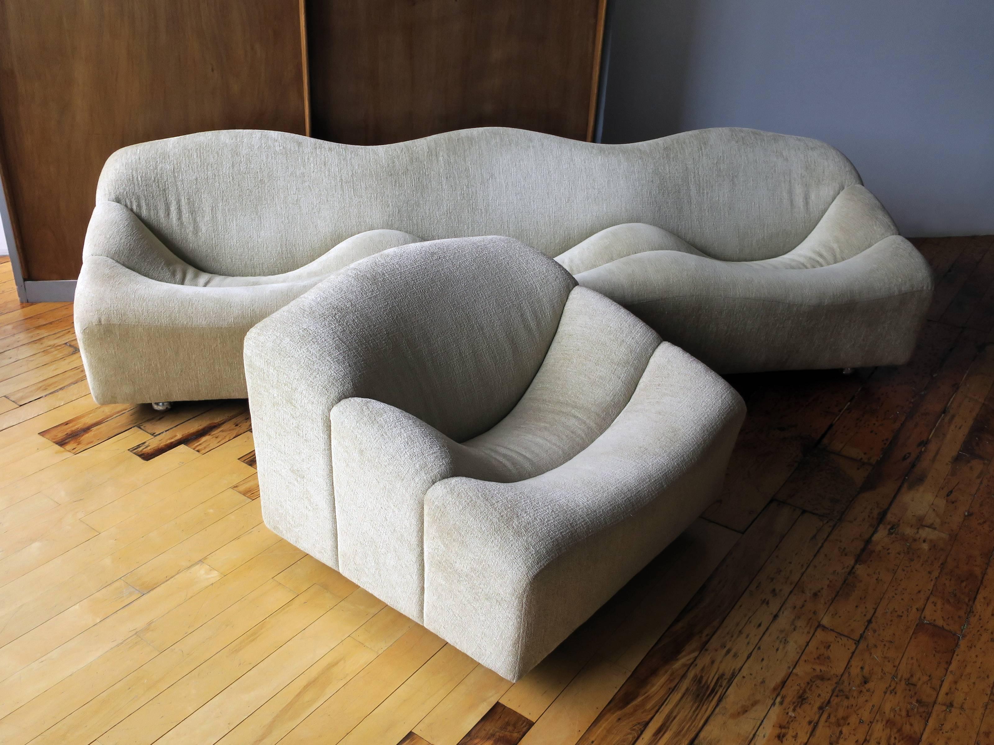 A beautiful early edition ABCD sofa and chair designed by Pierre Paulin, manufactured by Artifort, circa 1968. Refreshed in early 2017 in high-end upholstery. Both chair and sofa sit on original wheels.

Dimensions listed are for sofa. Chair