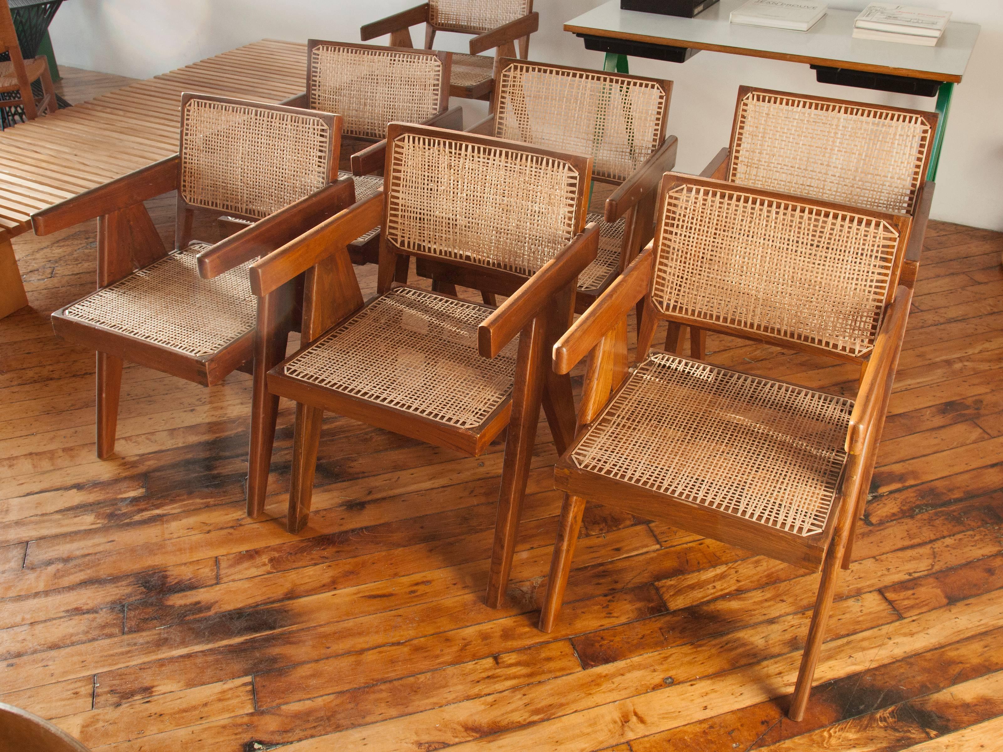 Exceptionally matched set of six teak and cane armchairs by Pierre Jeanneret from the administrative buildings of Chandigarh, India.