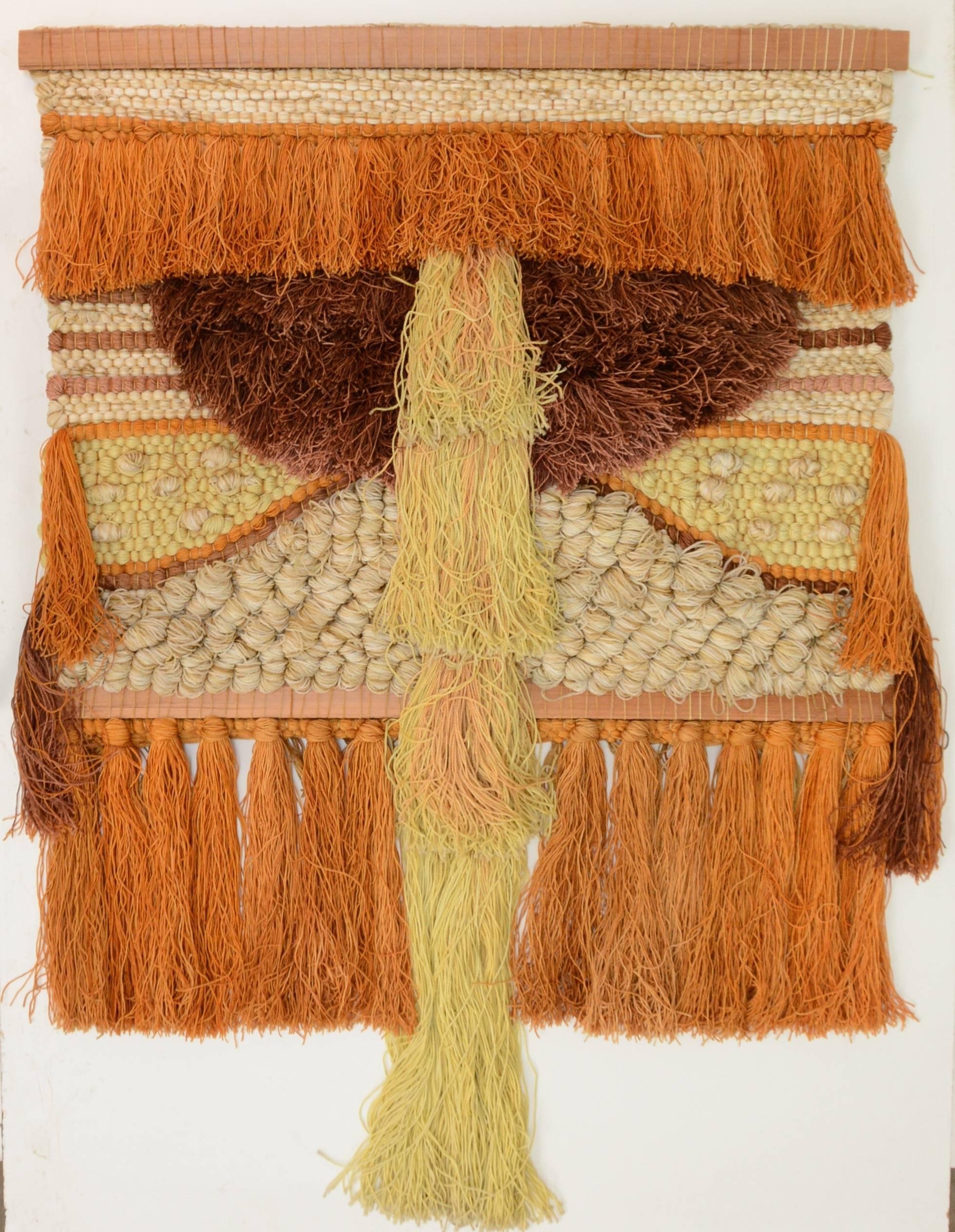 This is wonderful example of 1970s fiber arts movement. A very large, rare and beautiful wall hanging by Margo Farrin O'Connor for Ted Morris and associates. Made from a blend of wool and nylon. This piece retains its original color pallet and is in