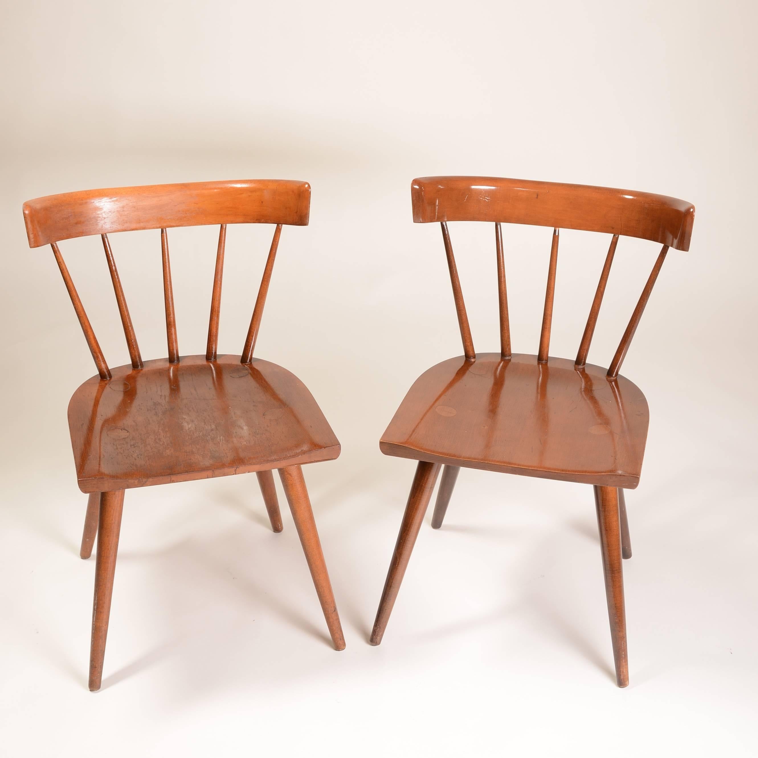 Designed by Paul McCobb for Winchendon's Planner Group line, this pair of Mid-Century chairs are made out of gorgeous stained maple. Clean lines and curved back support make them a sophisticated and unique edition to your home.
 