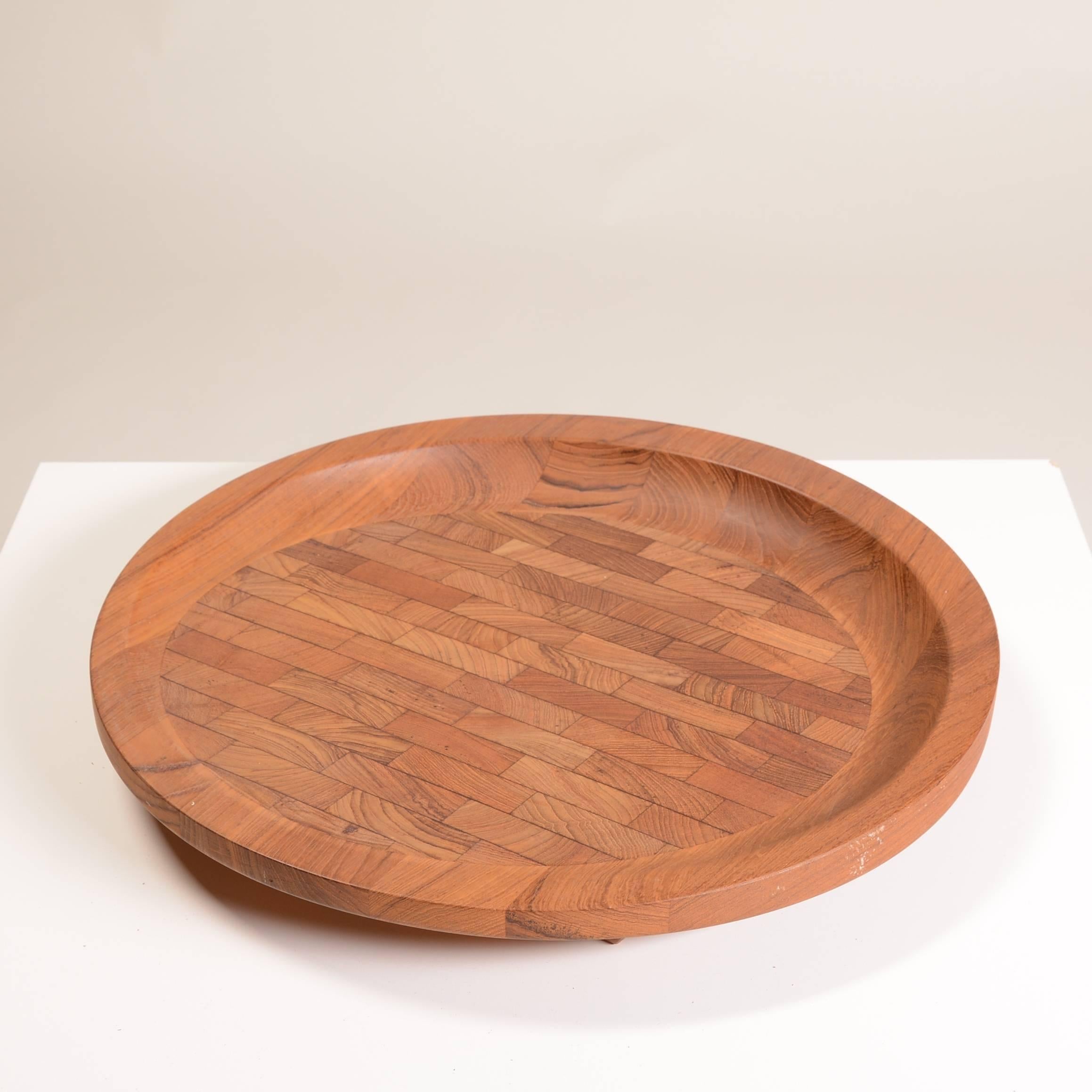 Large teak Dansk circular round cutting board designed by Dansk's primary designer Jens Quistgaardin. In the original catalog this is called a 