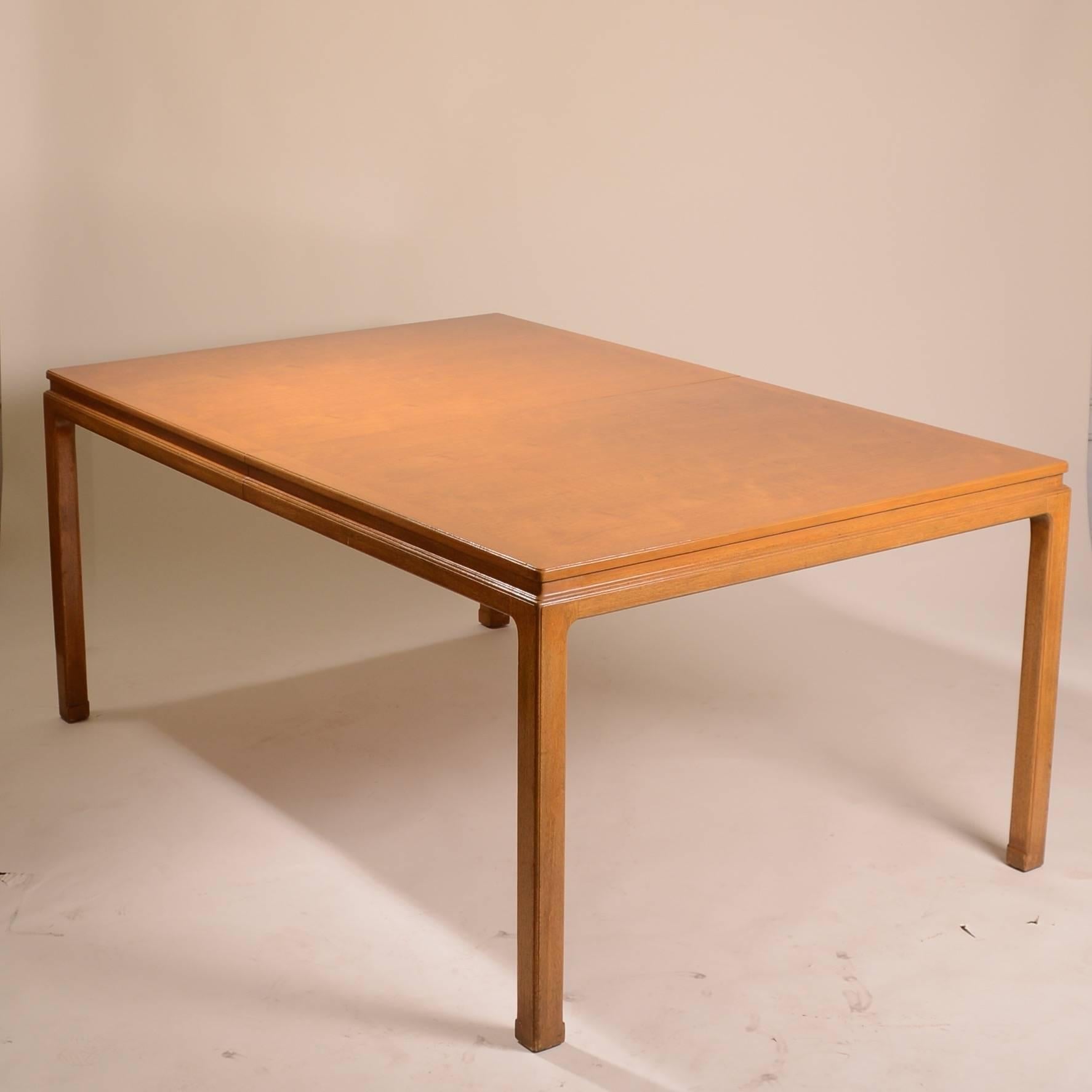 Rare mahogany dining table by Edward Wormley for Dunbar. This large expandable table retains its original finish which makes the mahogany radiant. The set includes two 12