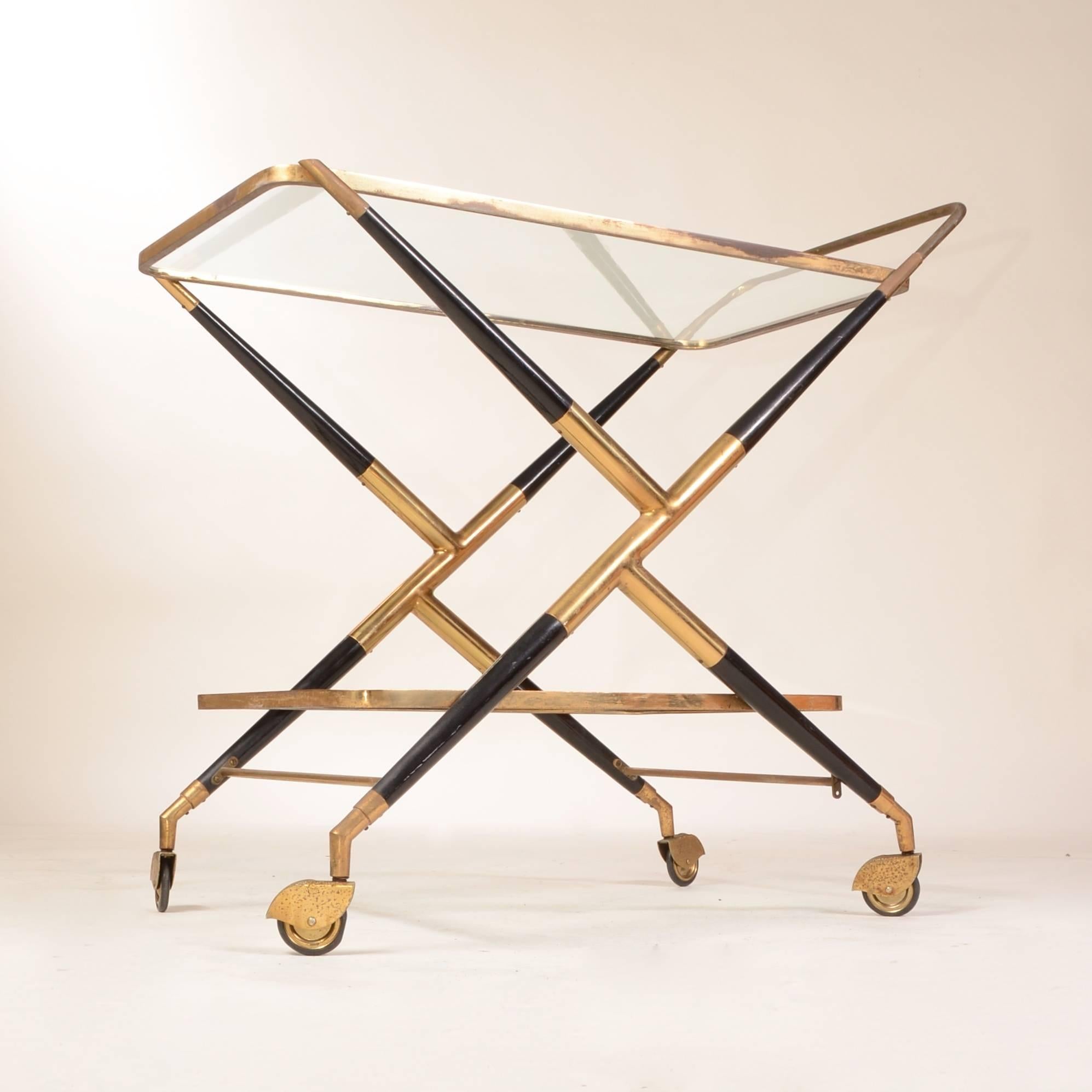 Italian designed brass, wood and glass bar cart by Cesare Lacca. Mid-century modern with a gorgeous patina. 