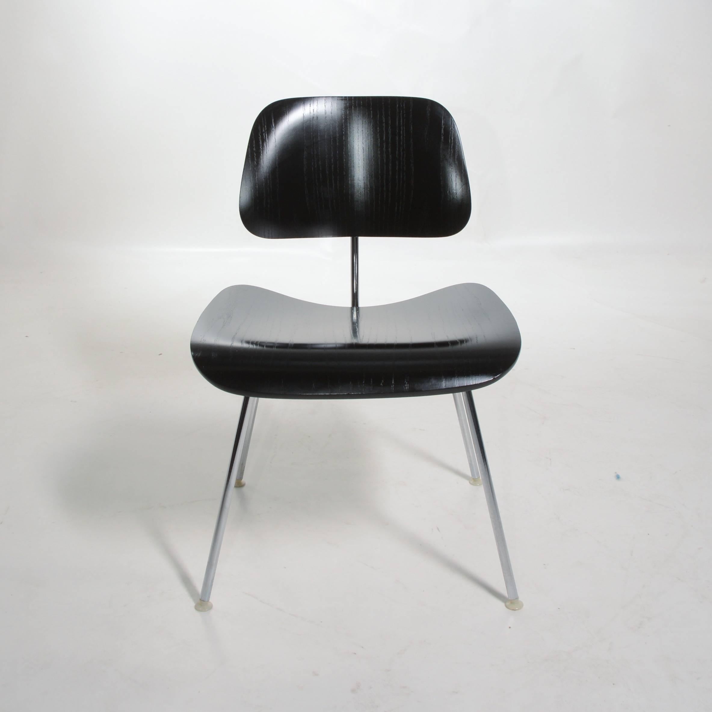 We have 4 black DCM (dining chair metal) chair by Charles and Ray Eames for Herman Miller. Original and in great condition.  