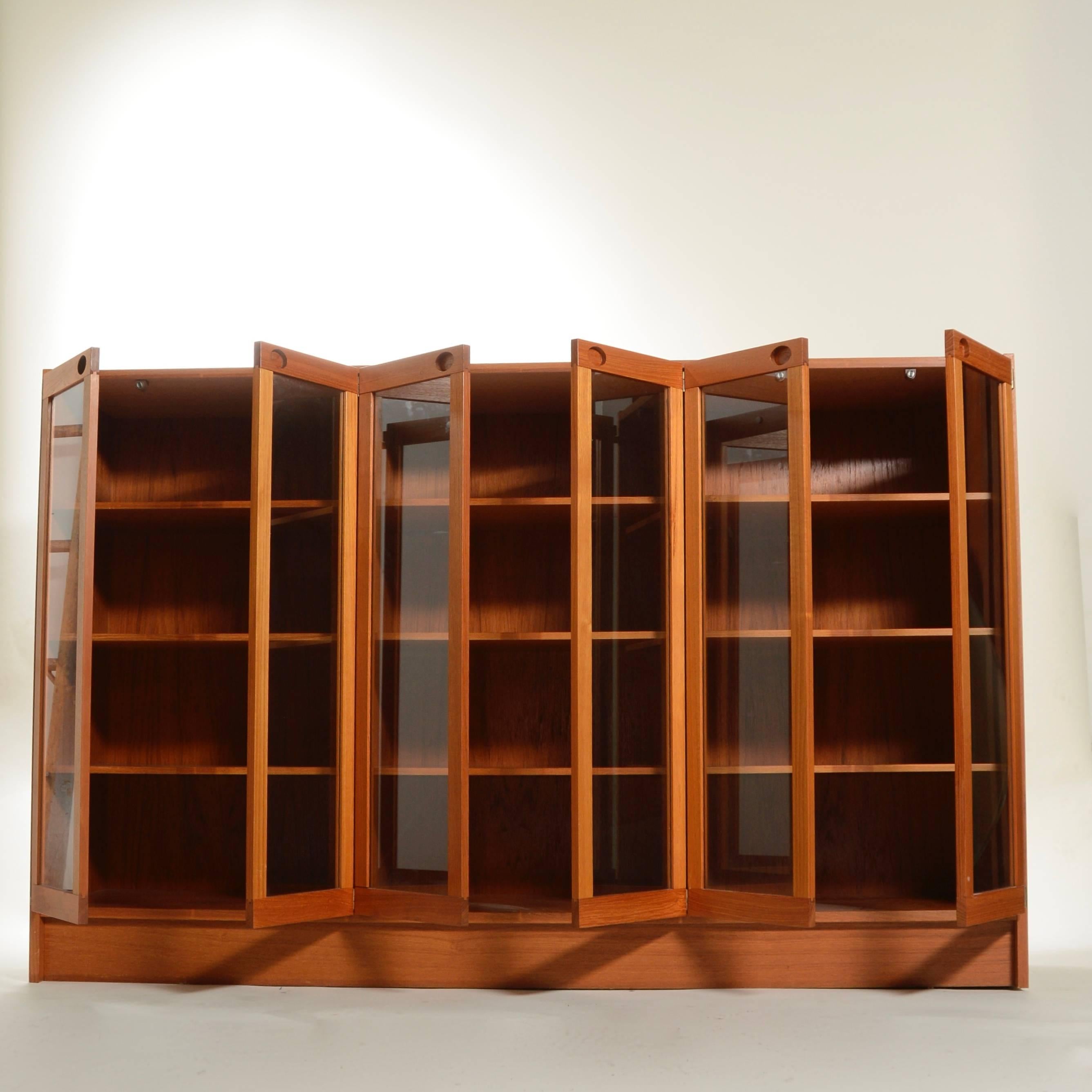 This beautiful Danish teak cabinet makes a stylish storage option for any room. Spacious and fully adjustable offering a nice variety of organizational space. 
In excellent condition.