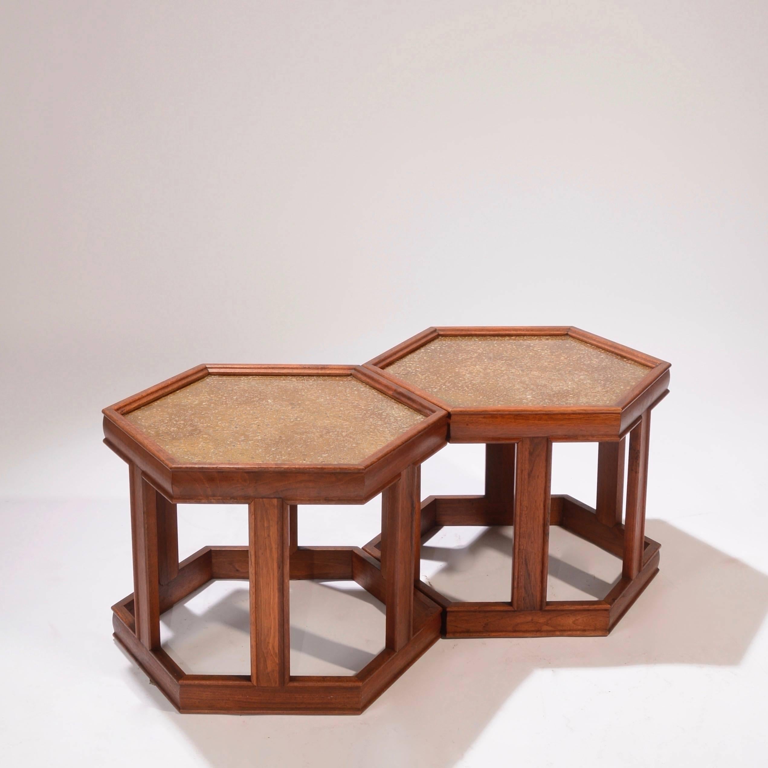 Set of two hexagonal John Keal for Brown Saltman tables. Frames are walnut with enamelled textured design under glass tops.
