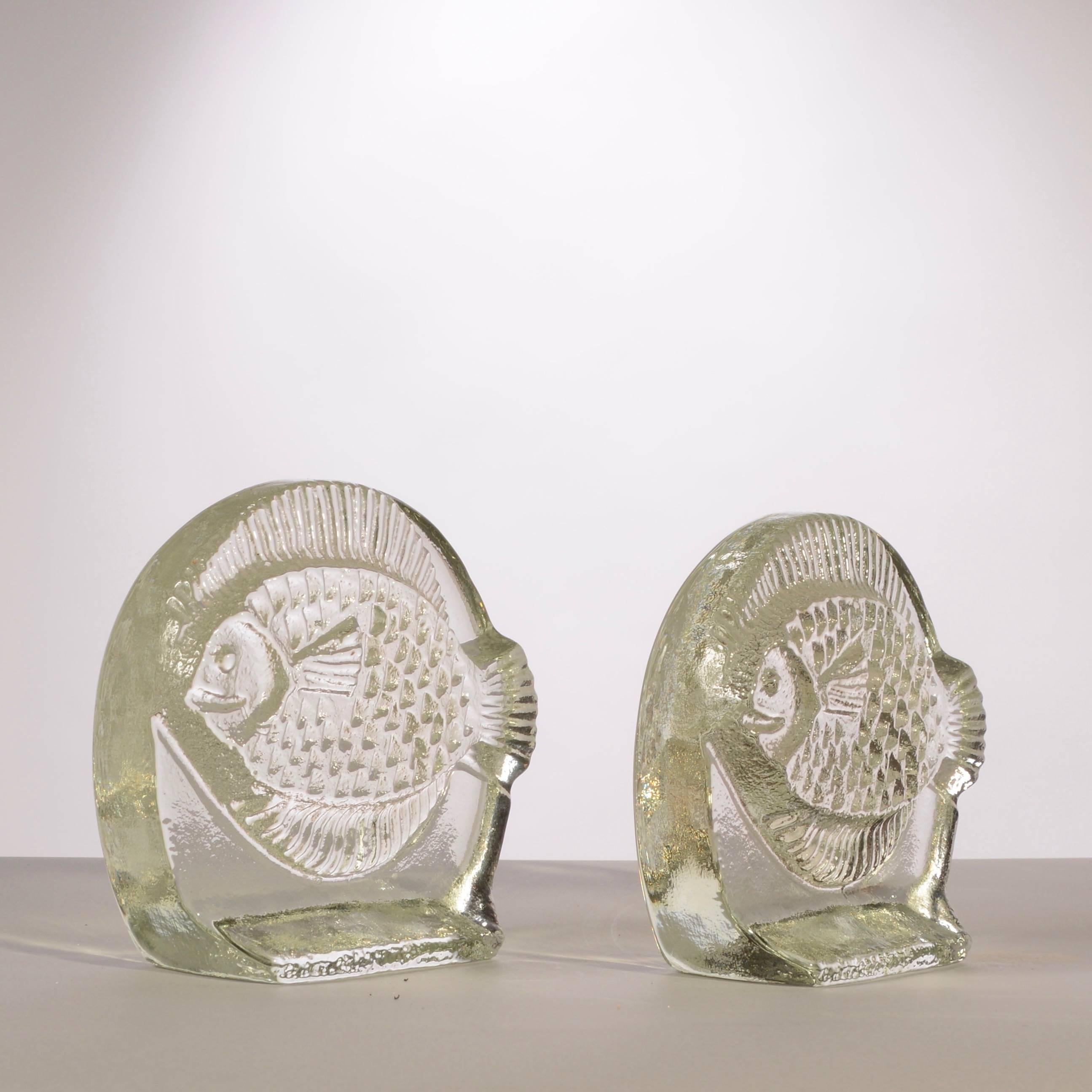 Mid-century era, pair of Blenko, thick glass fish bookends. Solid, handblown, with back side a smooth finish and front side a textural finish.