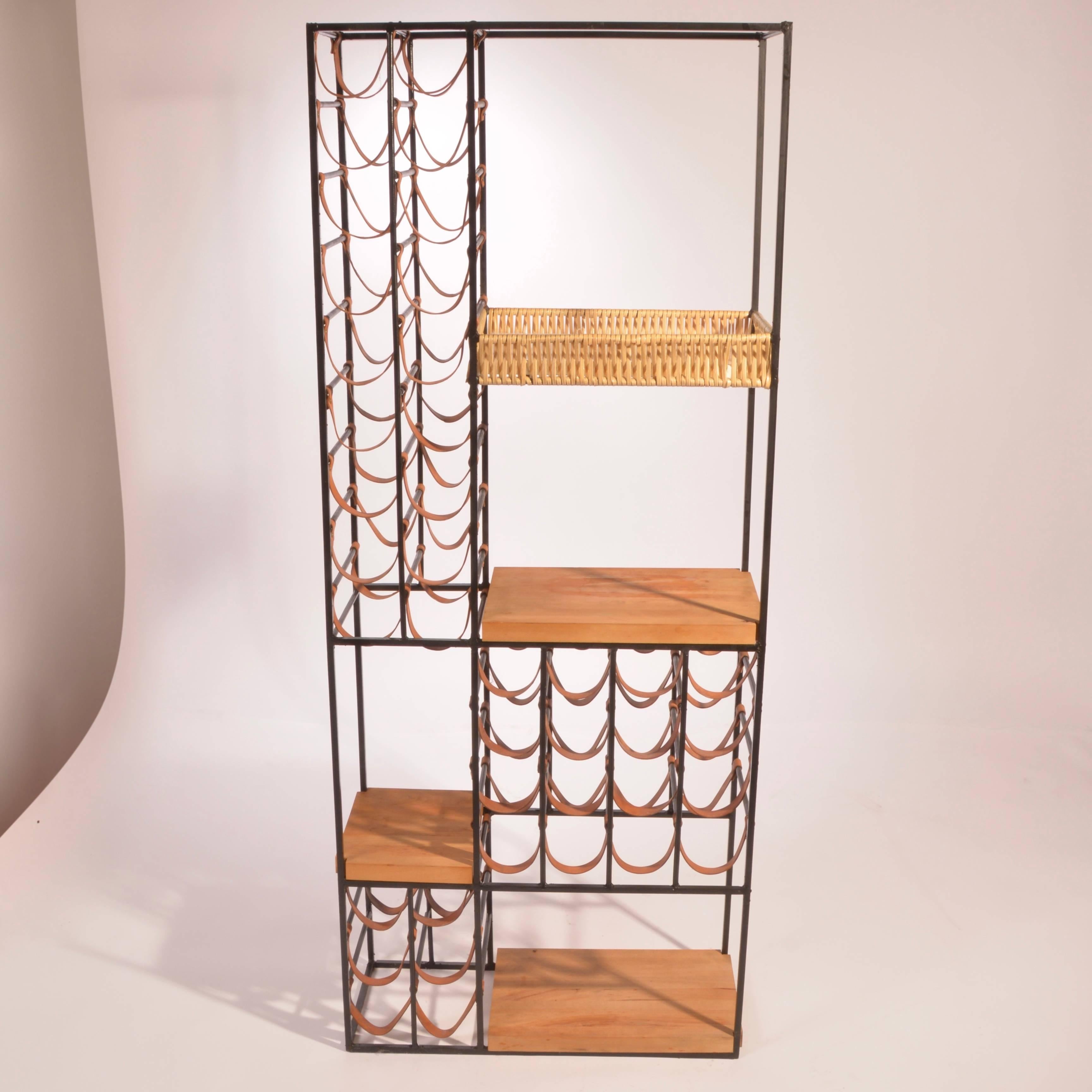 This iconic wine rack was designed by Arthur Umanoff for Shaver Howard in 1954.