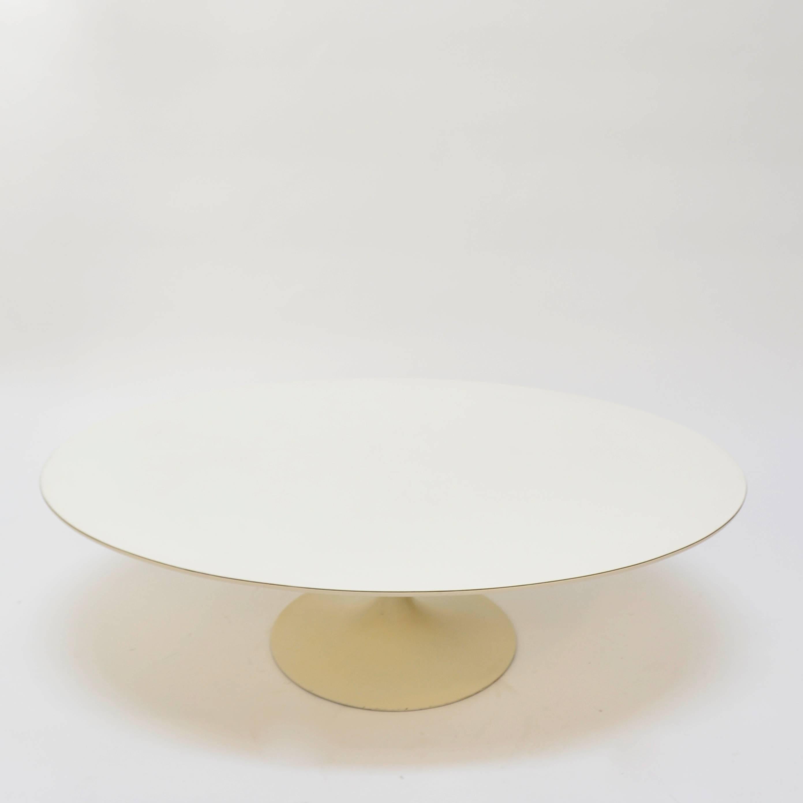 Very early cast iron base coffee table by Eero Saarinen for Knoll, white laminate top.
 