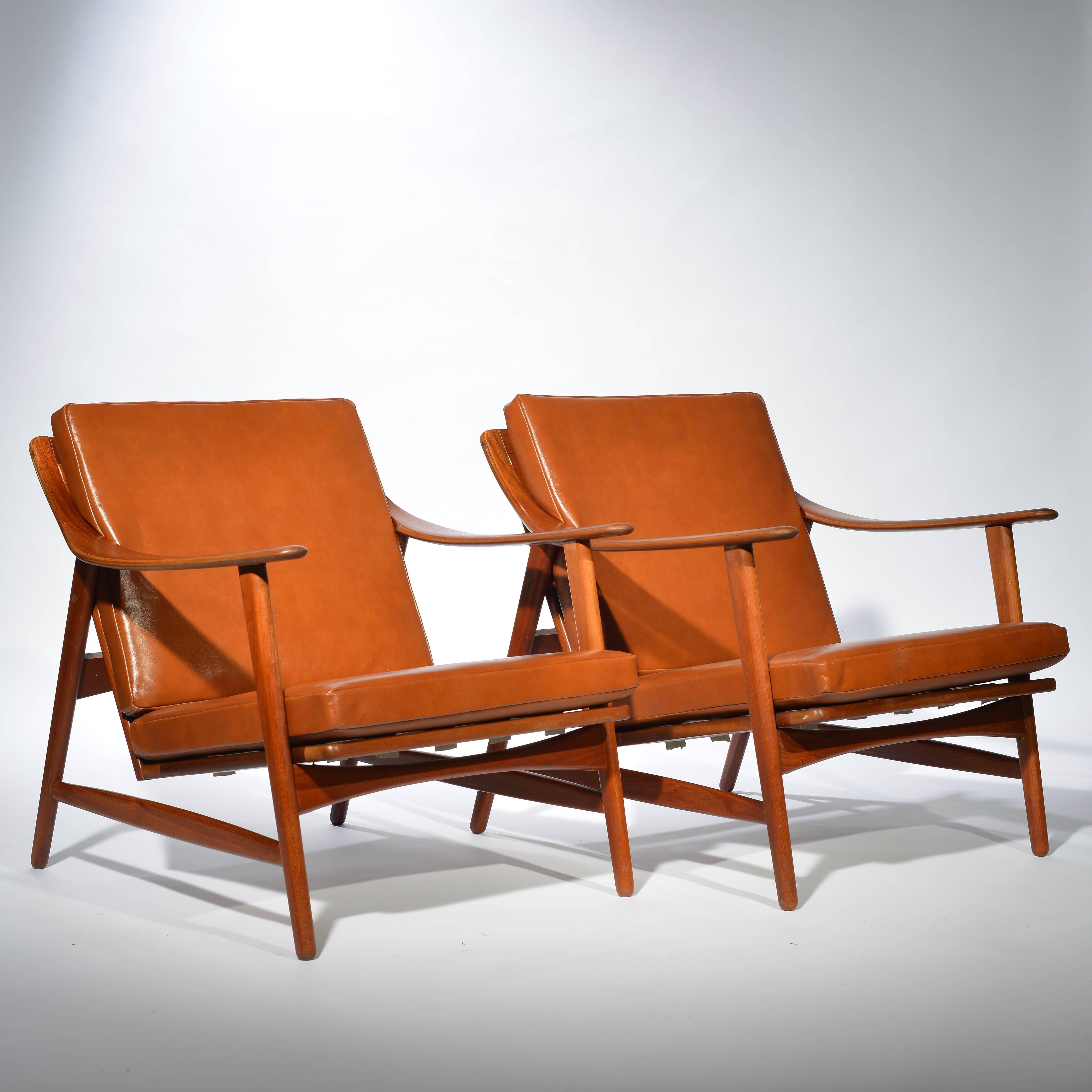 Very early and rare Arne Hovmand-Olsen for Mogens Kold teak and leather lounge chairs.
Fully restored wood and strapping, new leather cushions.