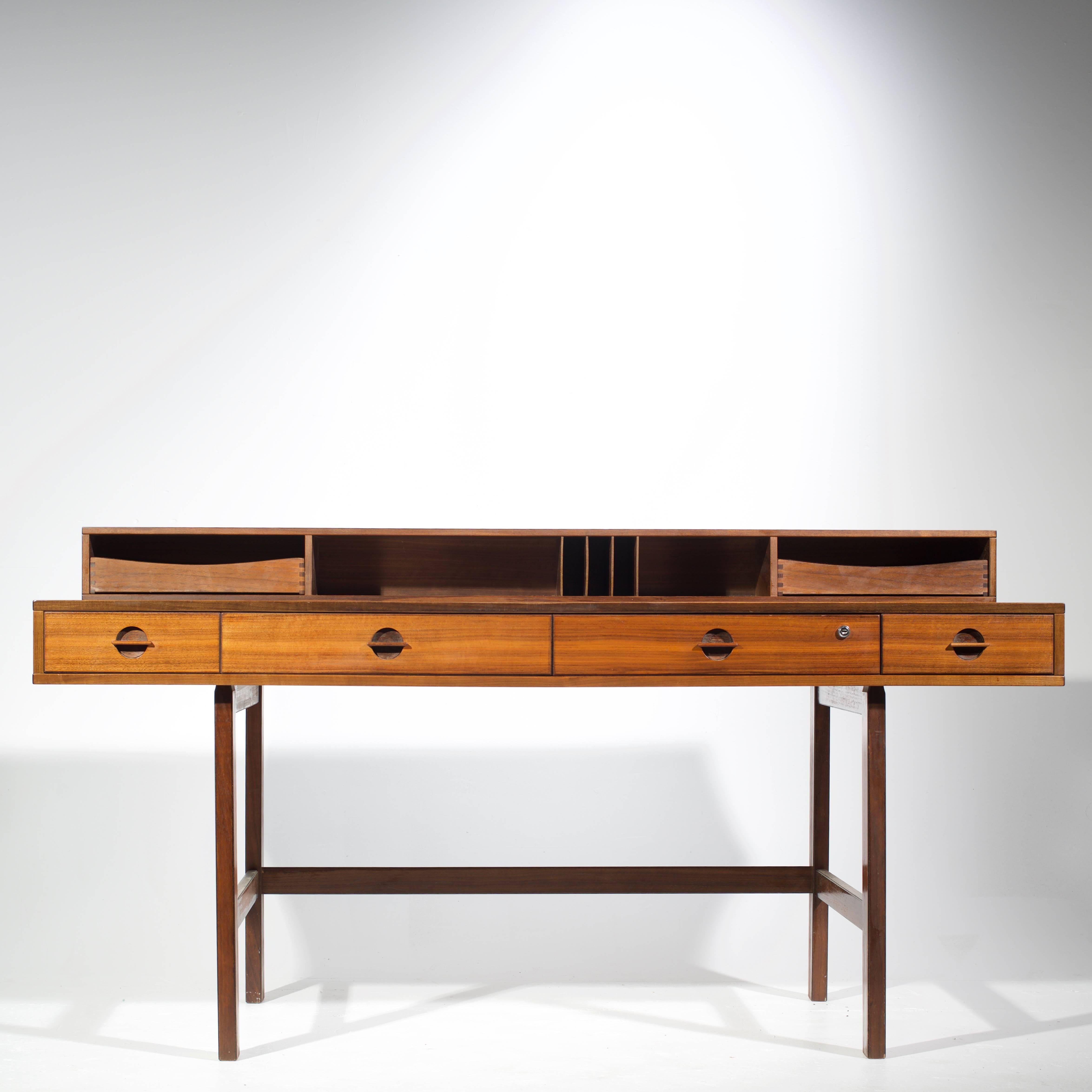 An expansive and expandable Danish modern walnut executive partners desk designed by Jens Quistgaard of Dansk for Peter Løvig Nielsen.