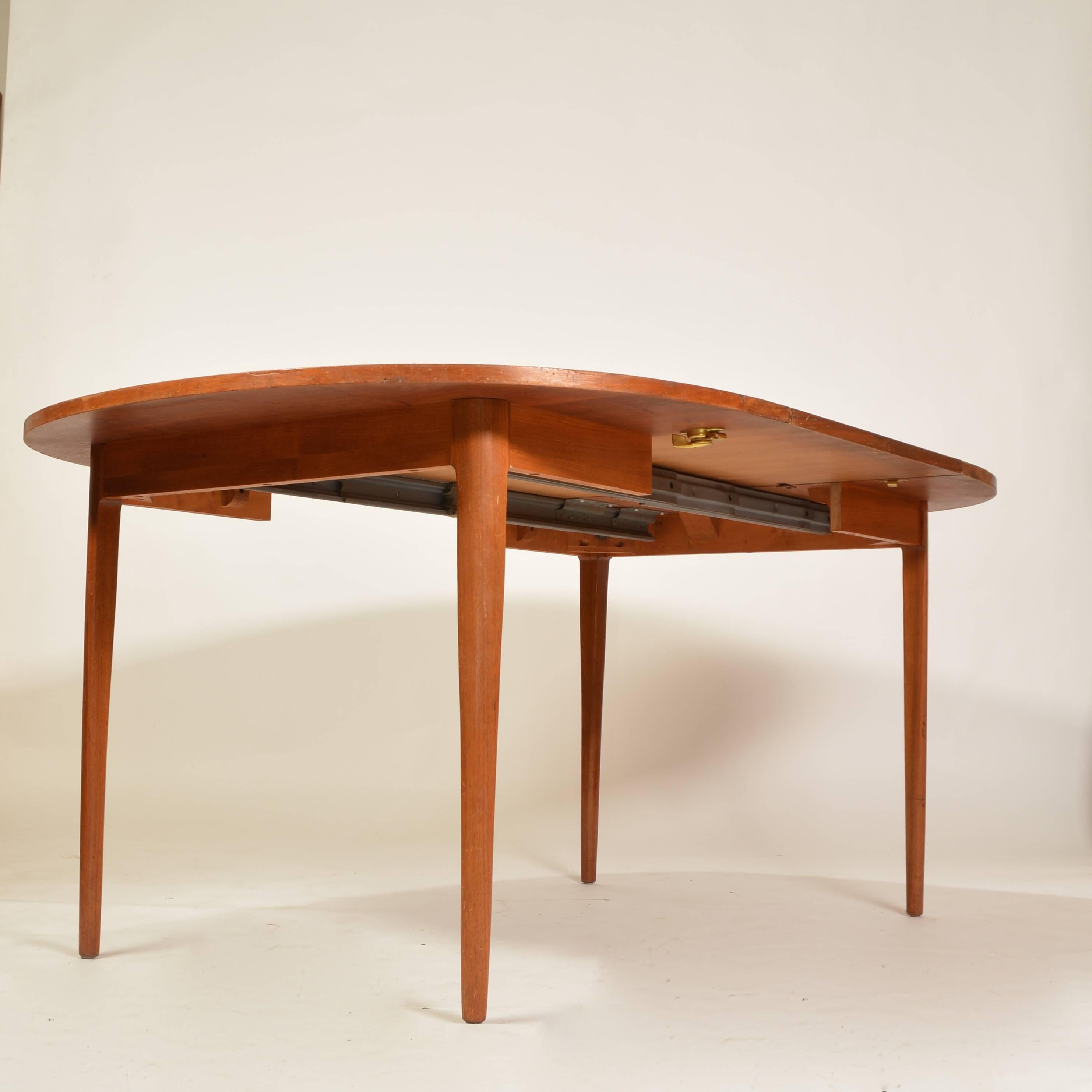 This is a beautiful american modern dining table by Kipp Stewart for Drexel.  The  finish retains the unique Drexel warmth.  Includes a 20