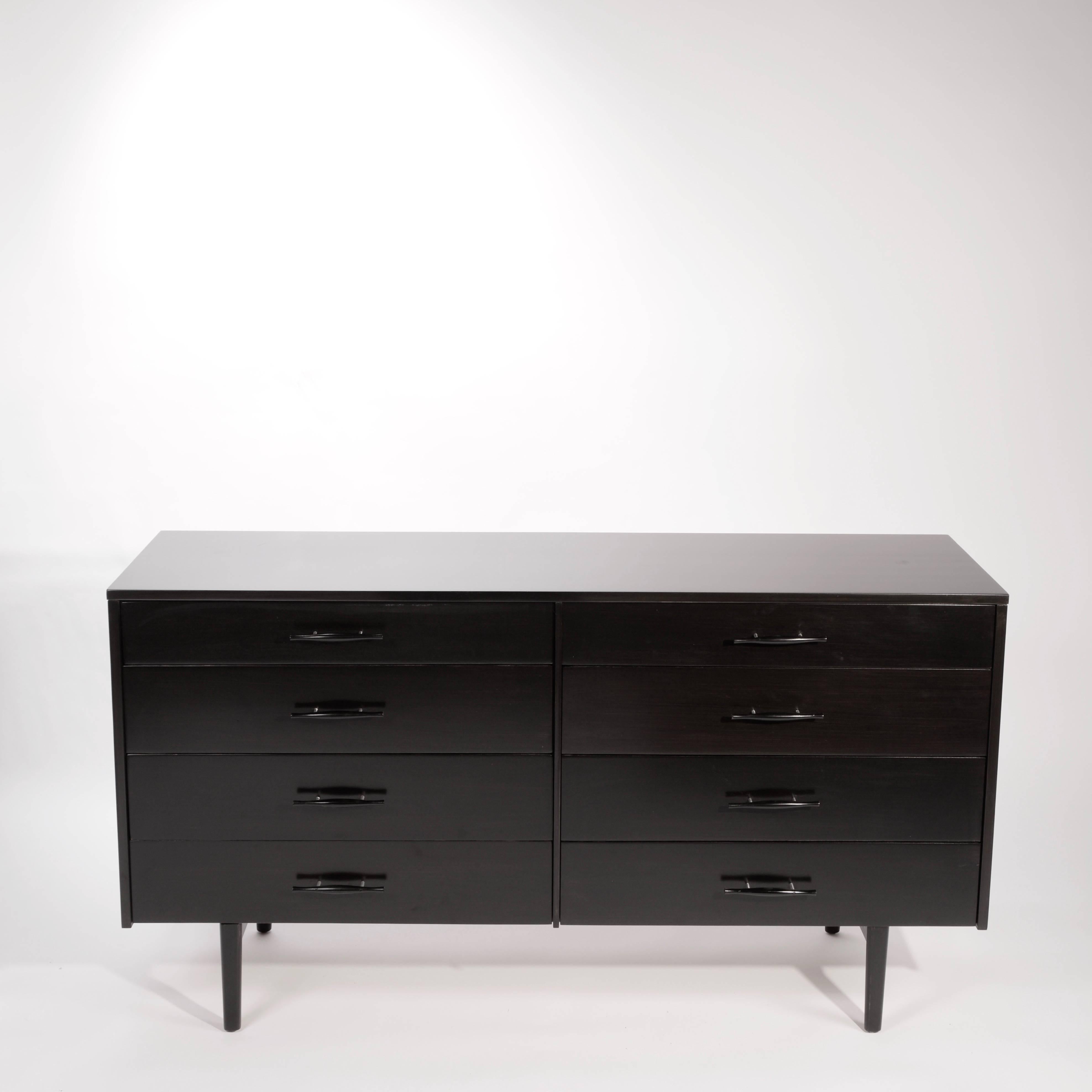 This is a newly restored and very rare Paul Mccobb for Planner Group eight drawer dresser in ebonized Maple. This piece features Mcoobb's signature clean lines and beautifully crafted hand turned drawer pulls.