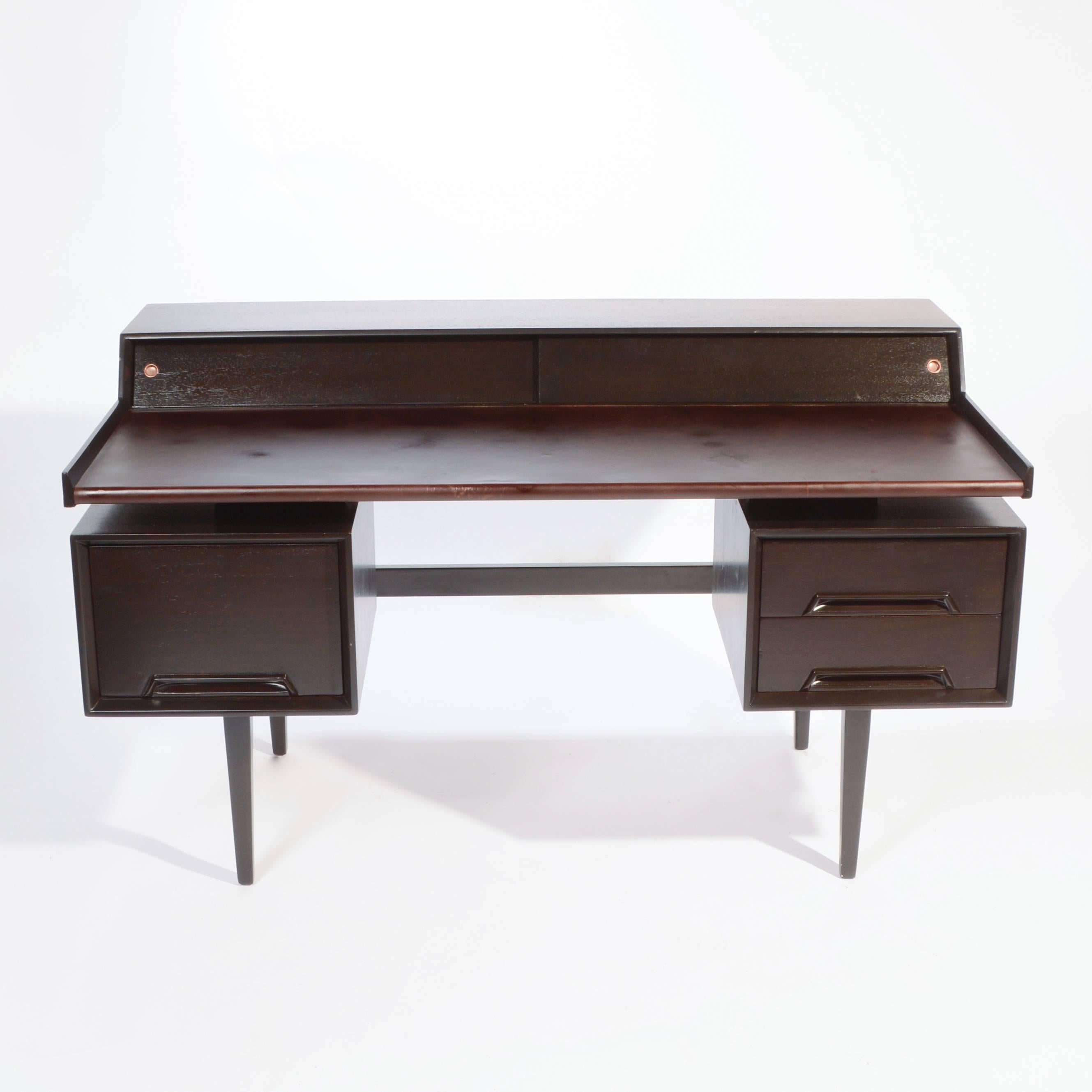 This is a fully restored Milo Baughman Floating-Top Desk from the Perspective line by Drexel. Desk Features two shallow drawers and one file drawer with dividers. Top has two sliding doors that open to reveal storage compartments. 
Writing surface