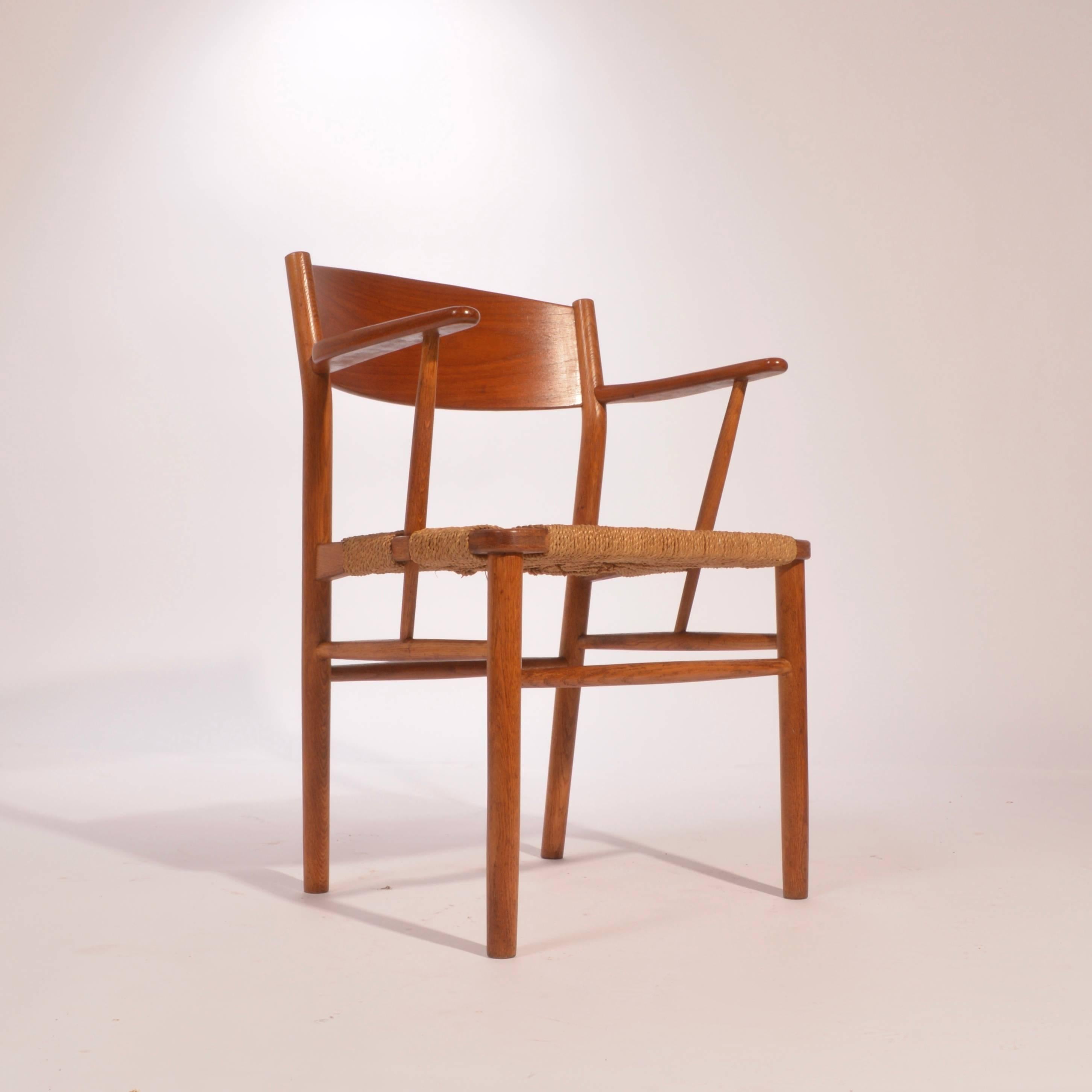 Børge Mogensen armchairs and side chairs for Soborg Mobler, 1954. Made from teak backs, white oak frame and woven seagrass seats. We have four side chairs and four armchairs in stock. Please inquire for individual pricing.