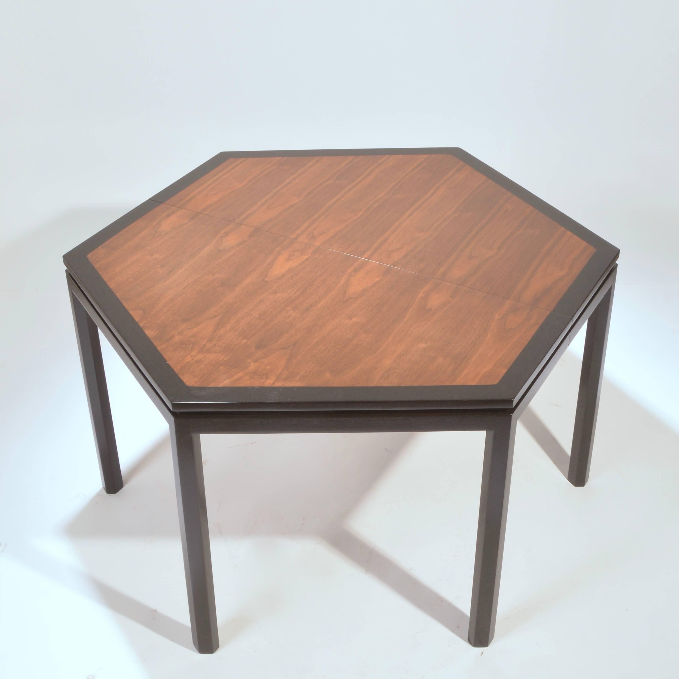 Extremely rare hexagonal dining table by Edward Wormley for Dunbar. Walnut top with ebonized mahogany border. Comes with two offset grain 16