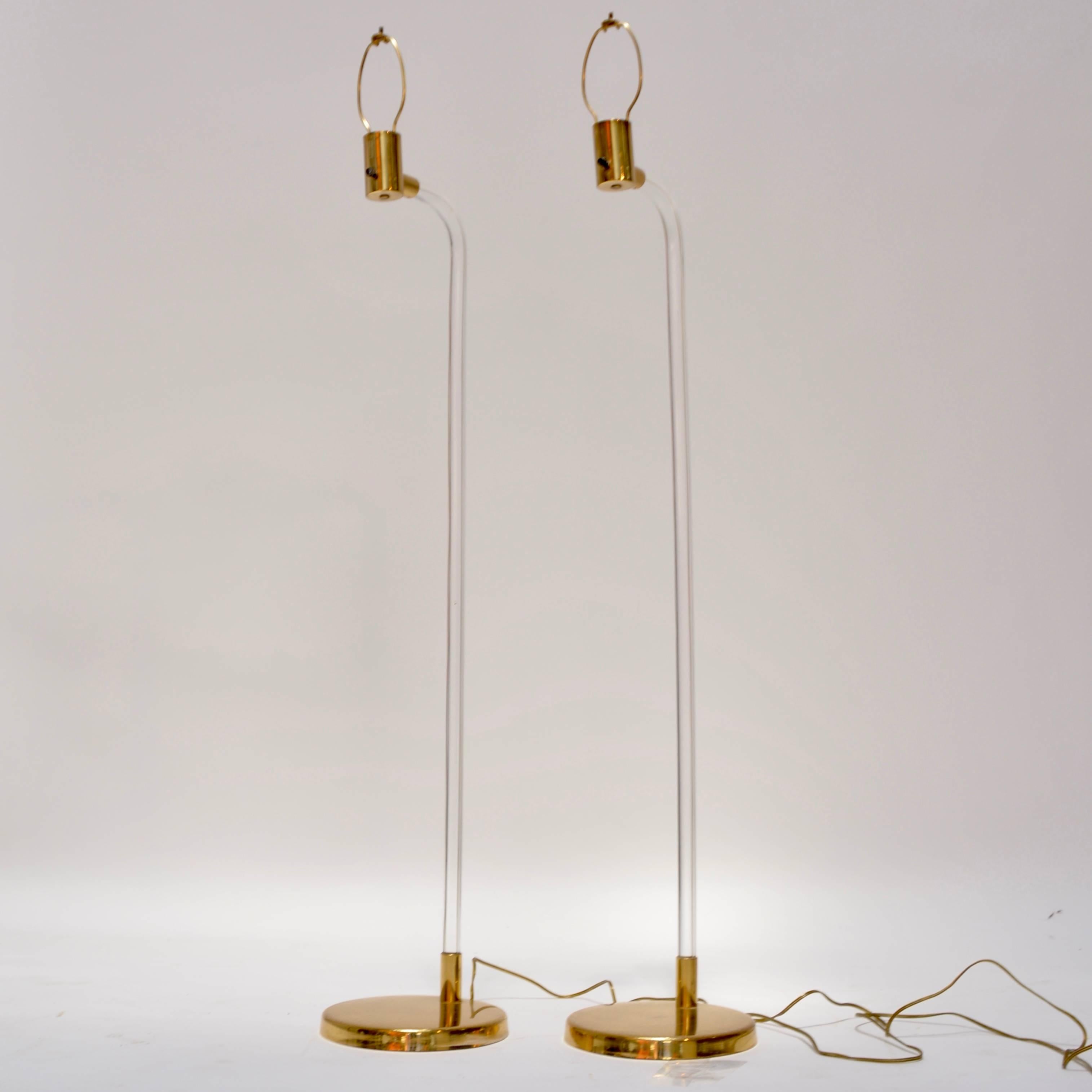 This is a pair of Lucite and brass floor lamps designed by Peter Hamburger for Knoll, circa 1970s.
 