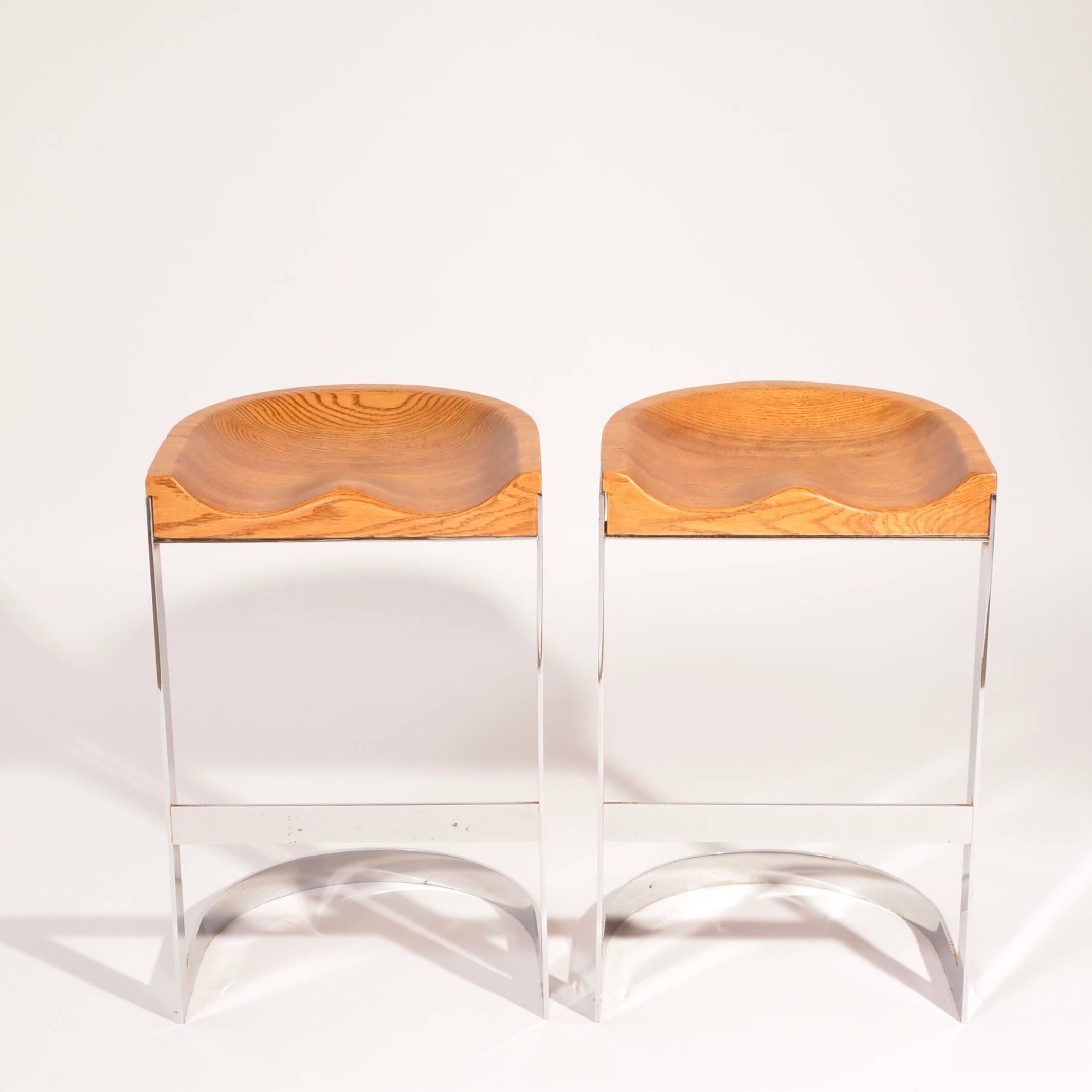 Light oak and chrome are united to create these chic counter stools by Warren Bacon.  Can also be sold as set of 4 or 6.