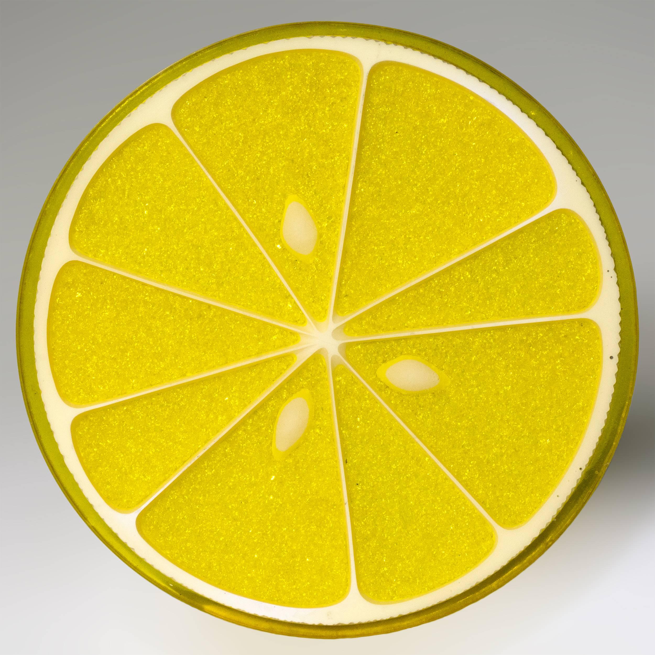 A citrus slice table by Carl Chaffee, circa 1970.
A realistic lemon slice in resin with crushed glass
pulp and white ceramic seeds and pith. 
The trompe l’oeil top raised on a cluster of 12
rubber tipped chromed steel rods.
   