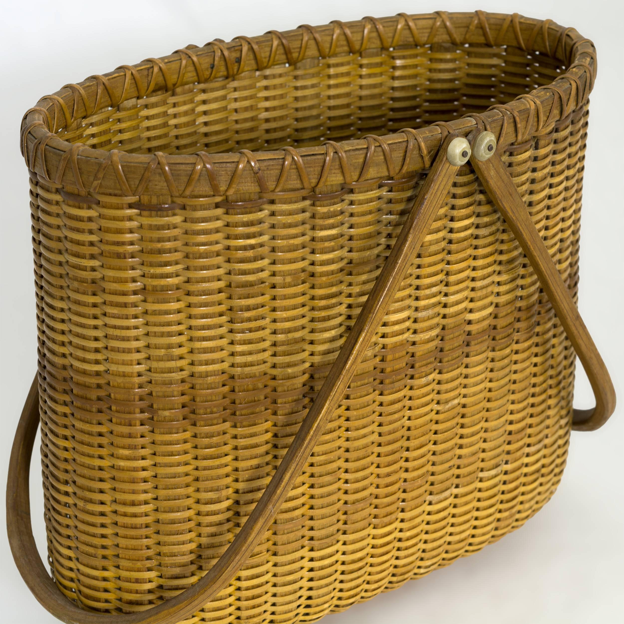 Double handles with bone knobs and a rich honey patina. Paul Willer made baskets at the House of Orange on Nantucket from the 1970s to the early 1990s. He is no longer making baskets, they are becoming scarce and are highly collected.
