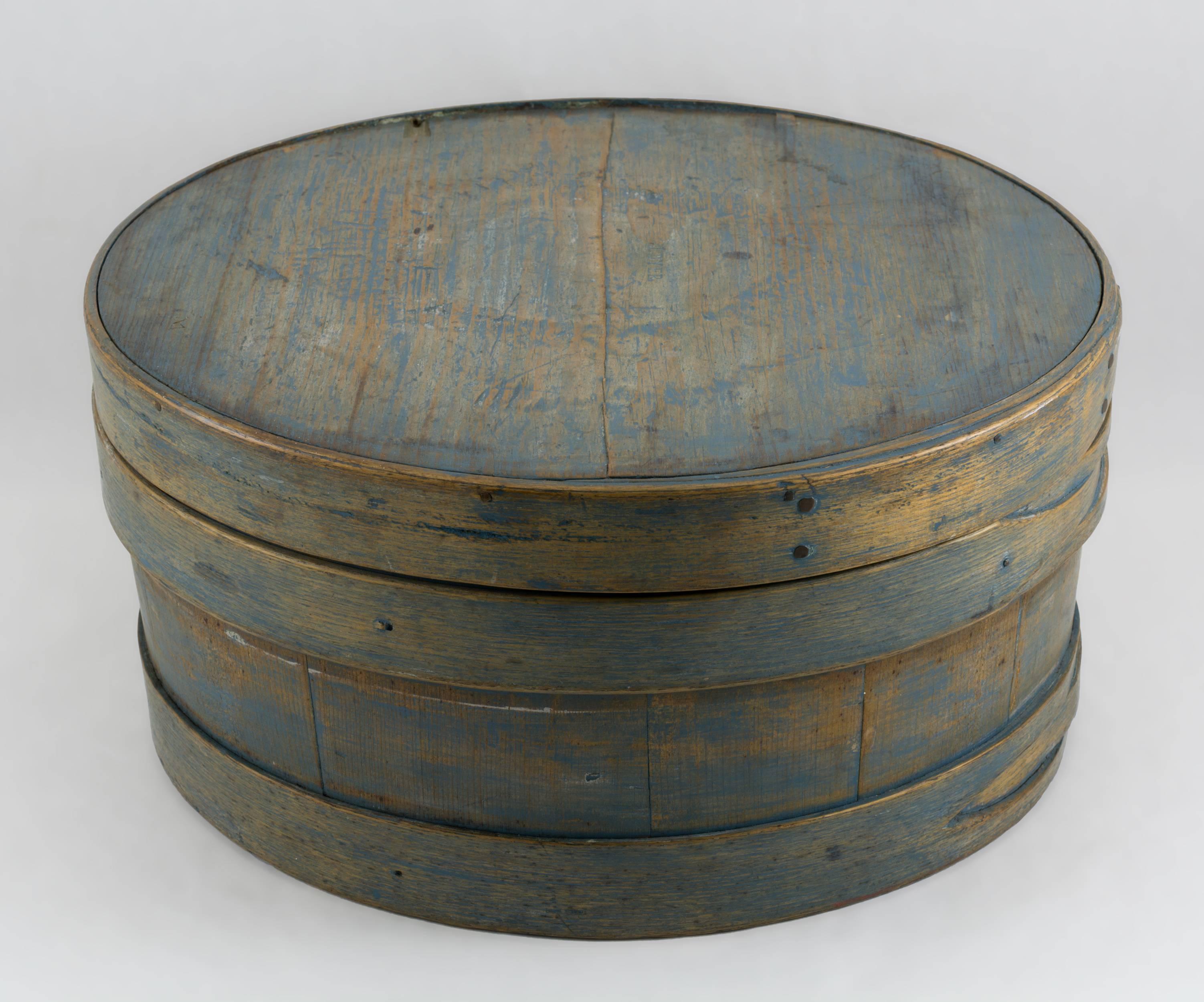 Round staved cheese box with two button hole hoops and matching fitted fingered lid. Both the lid and the base have a stamped impression of its owner, 