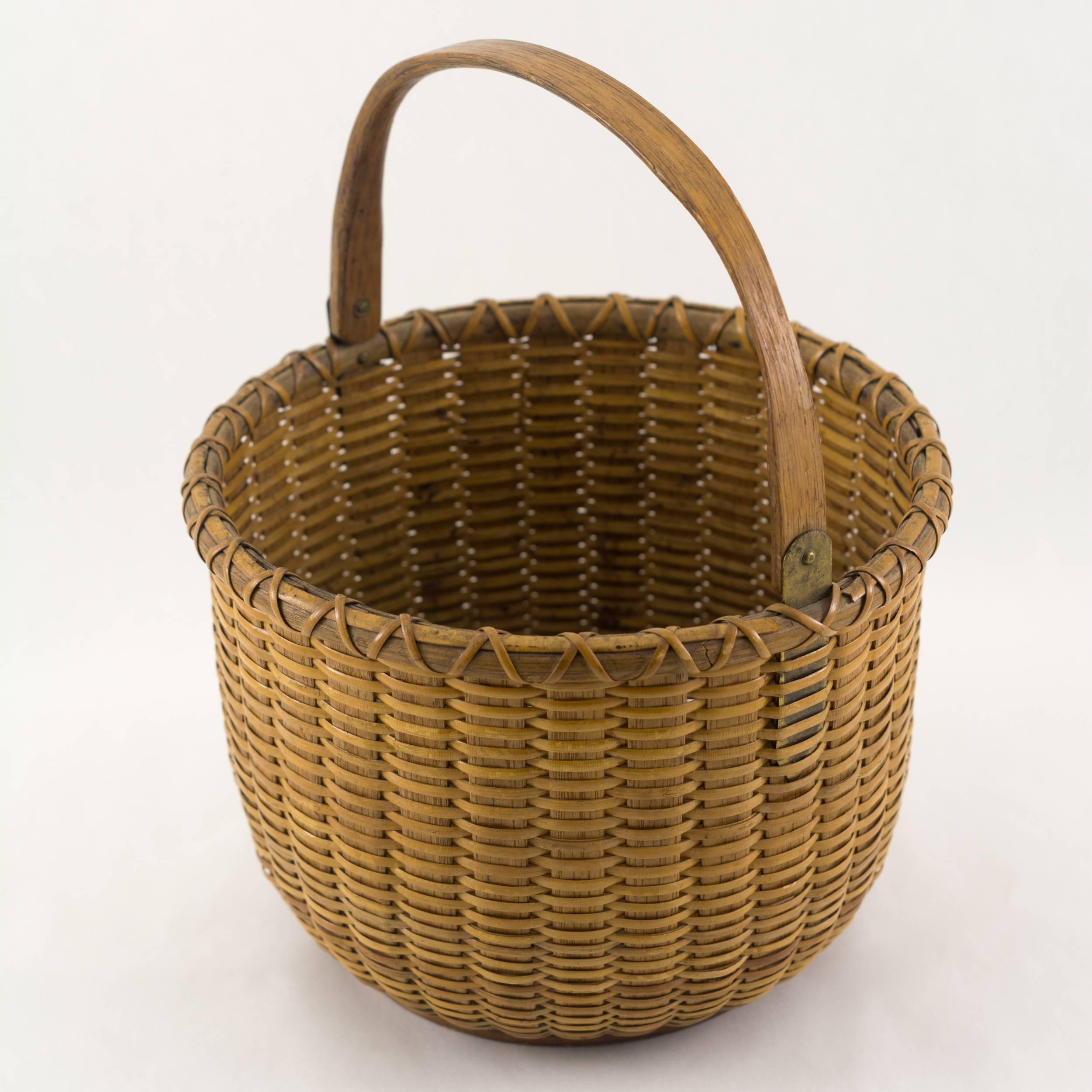 7 ½” open round Nantucket lightship basket with
brass ears , “R Folger Maker Nantucket, Mass” is
stenciled on the interior bottom, circa 1875
Rowland Folger (1803-1883).