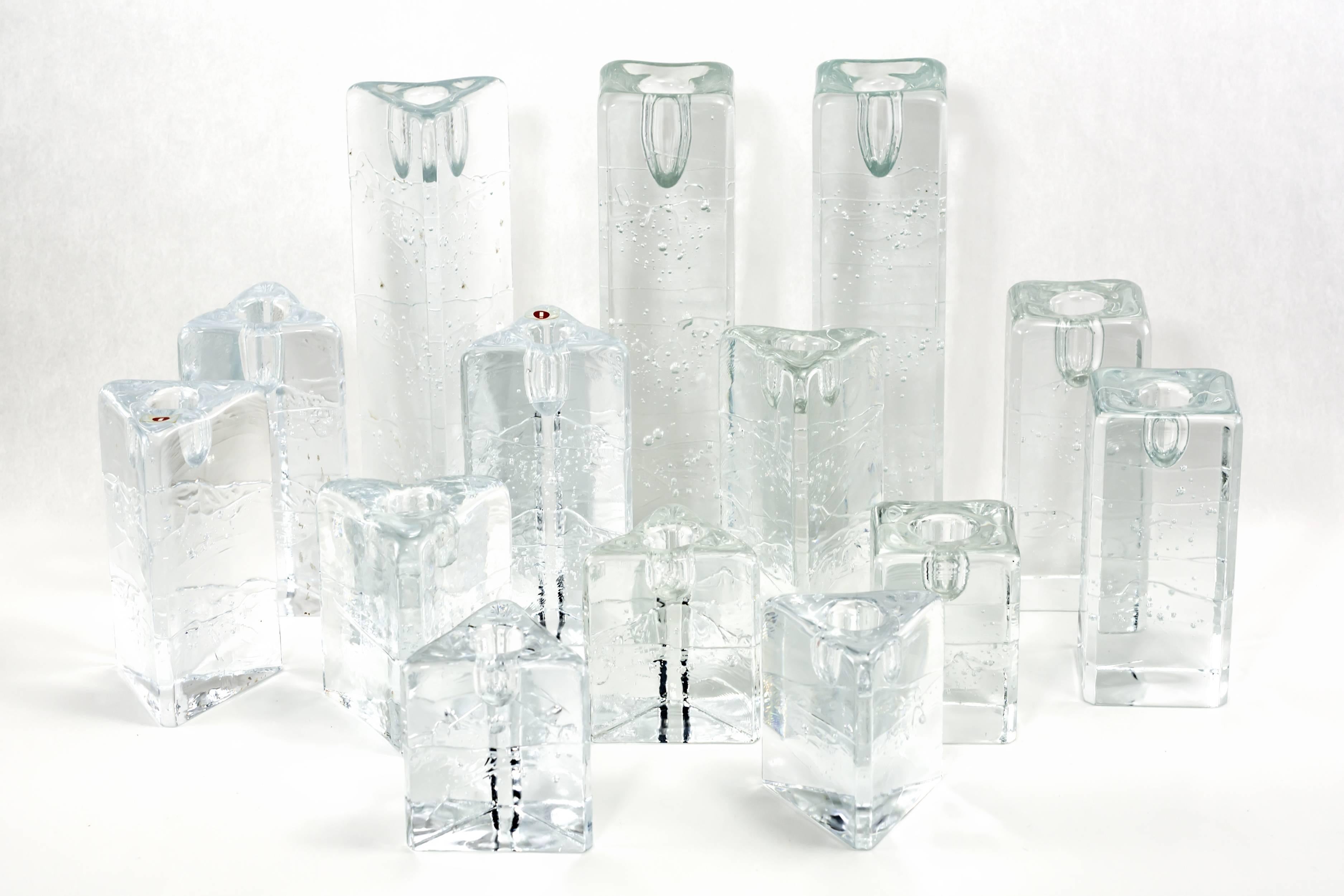 Group of 14 Iittala Arkipelago candlesticks in square 
and triangular forms. Architectural cast clear glass blocks 
with bubbles and inclusions appear to be carved from ice.
Finland, circa 1970
Measurements:
3-1/4” – 8-3/4”.


 