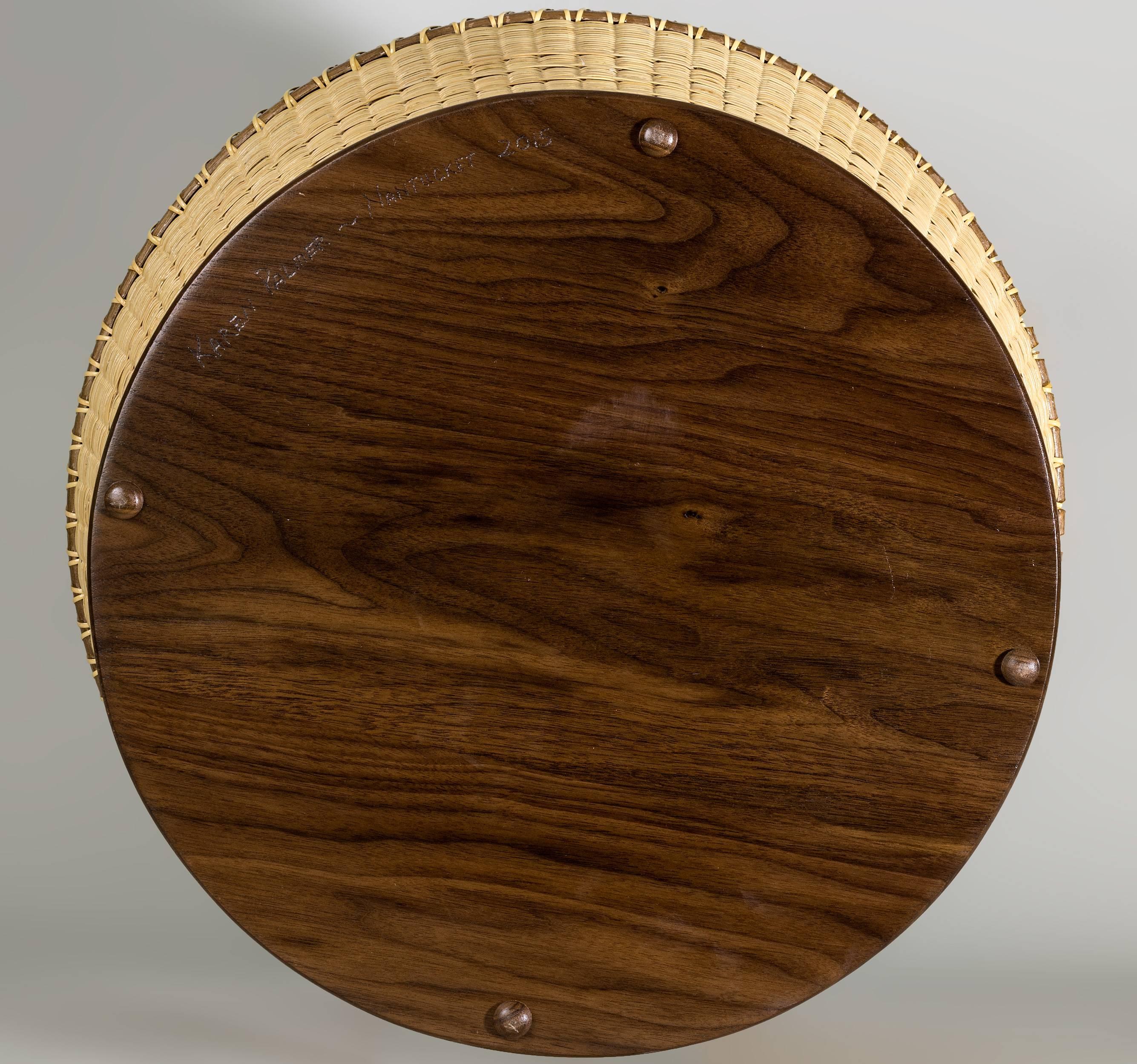 Large Nantucket basket woven around a galvanized steel insert, featuring flattened and double-lashed walnut rim, wide walnut staves, and substantial walnut base.  With delicate spiral pattern centrally incorporated into the weave of the body,