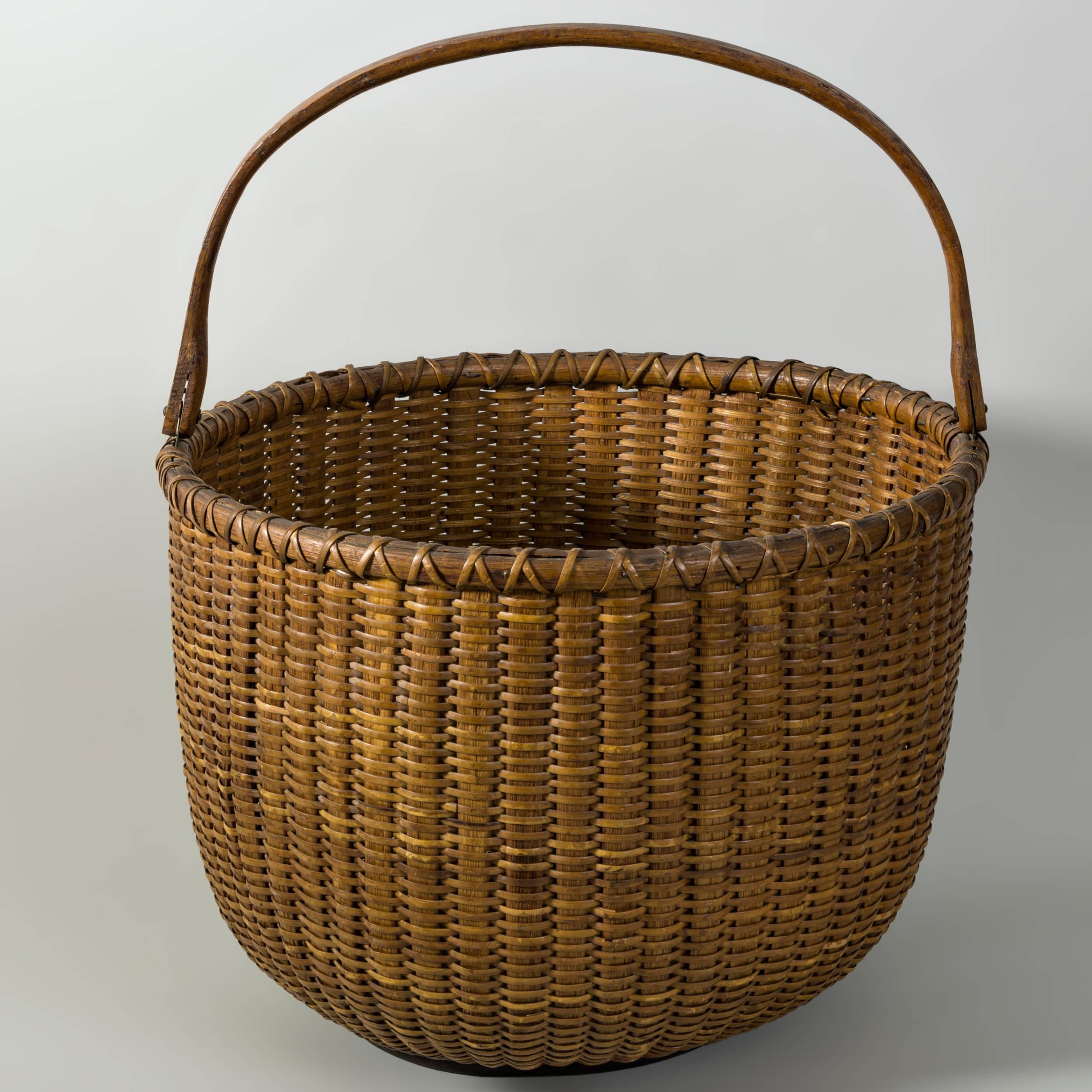 12”Open round Nantucket lightship basket
with Oak swing handle and Mahogany bottom
Attributed to Ferdinand Sylvaro (1868-1952)
c.1930
                       				    