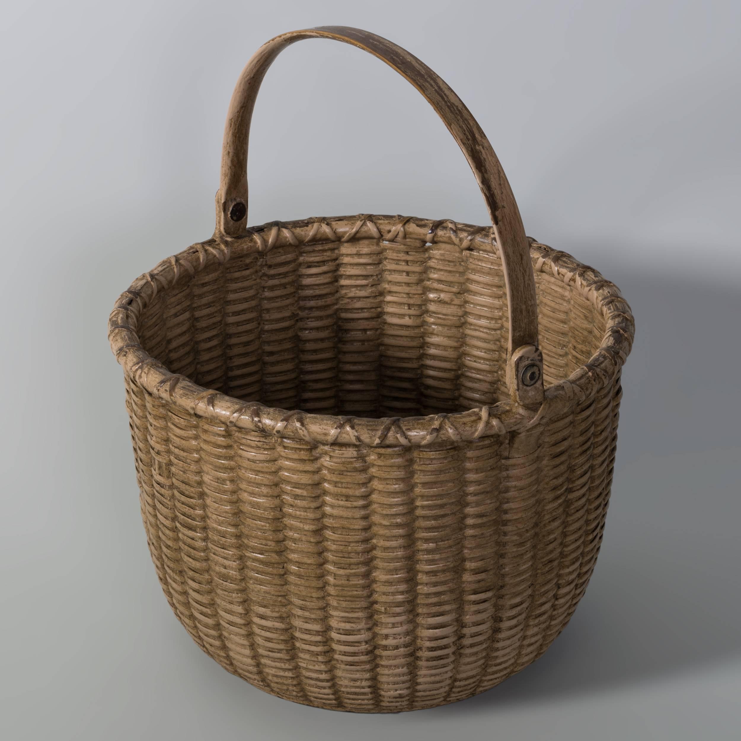 9” Open round salmon painted Nantucket
Lightship basket with wooden ears and
original paint. The nails on the interior bottom
indicate this was probably used as a vegetable
basket, Unknown maker, c.1880-1900
 
                                 