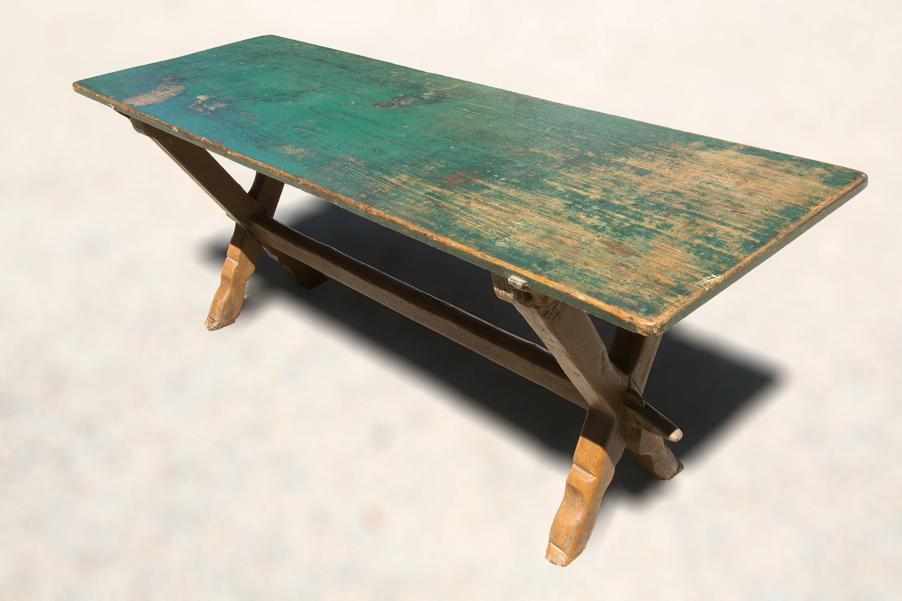 Painted trestle table with one board green top and sculptural trestle base,
made of pine

Measures: 29 x 75 x 25.

    