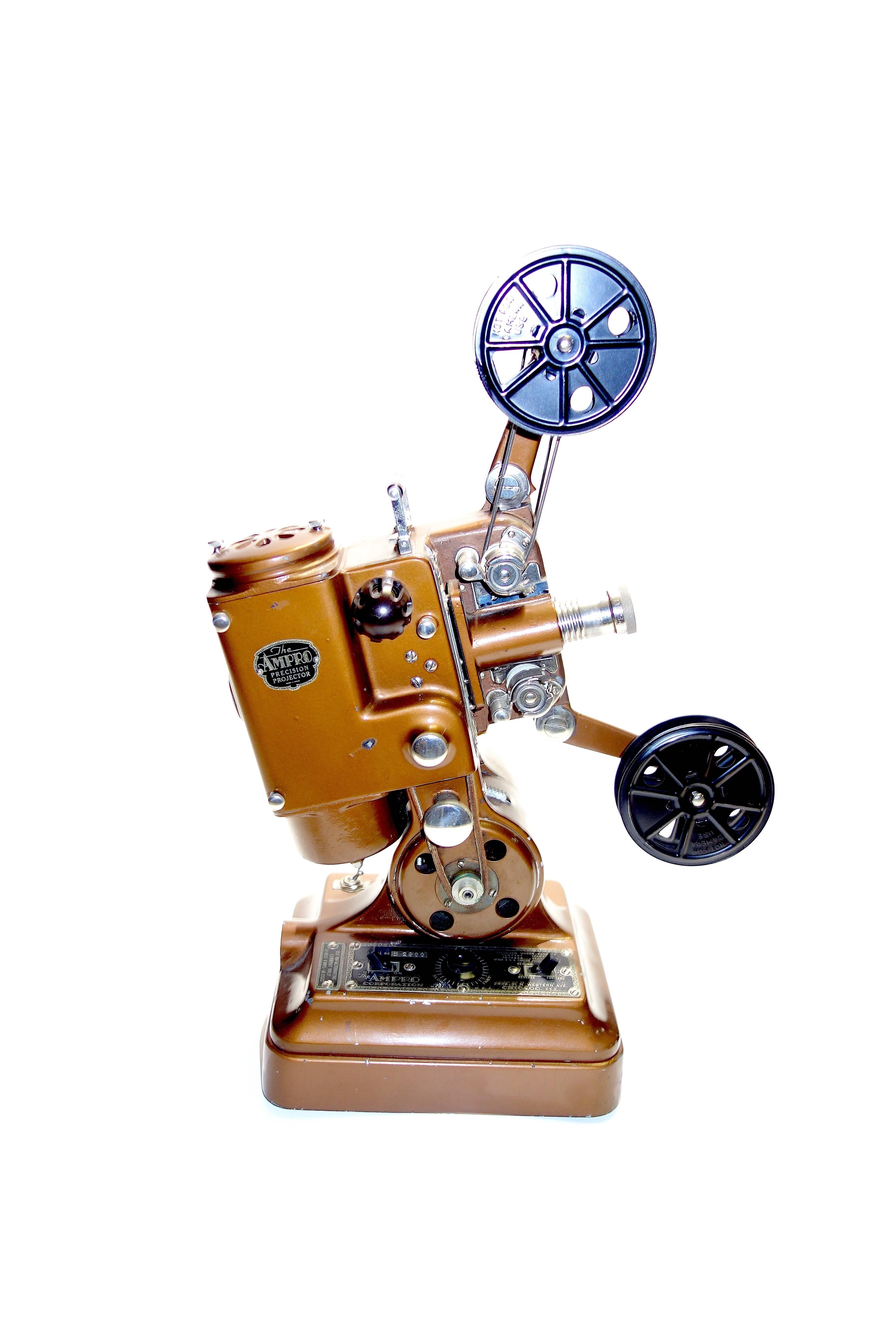 Submitted for your approval this circa 1930 Ampro Precision 400, 16mm cinema projector.
A wonderful working display of a beautiful Art Deco design. All original finish with accessories. This is a rare version with both chrome knob finishes and a