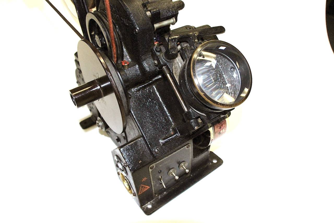 Offered for your consideration is this rare Moviola, model D, 35mm motion picture film editing machine, circa 1932. Included with this piece of Iconic Hollywood motion picture equipment is the AC power cable, two chrome finished vintage reels with