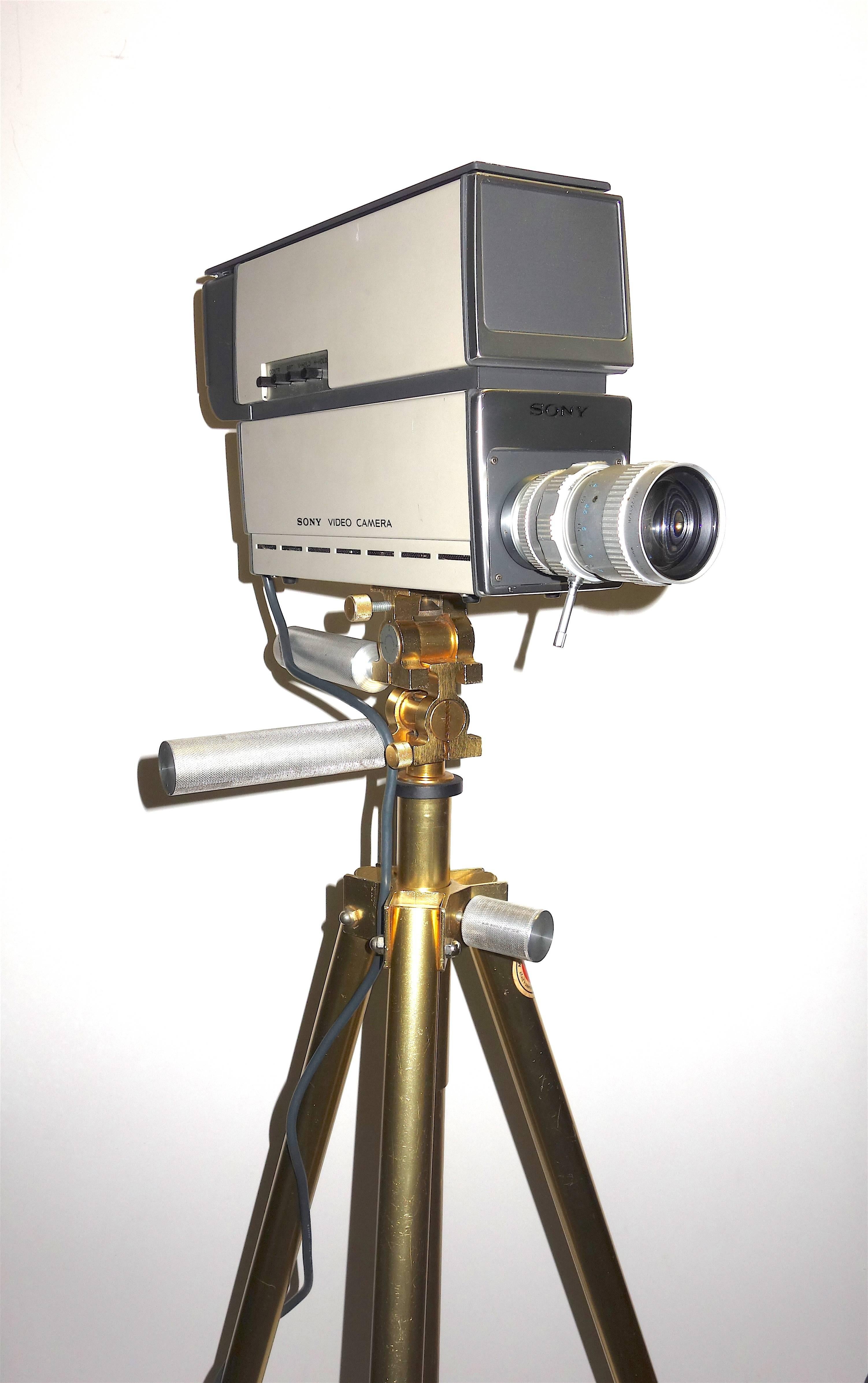 Submitted for your consideration is this, circa 1969-1970, Sony vintage Vidicon industrial television camera complete with studio viewfinder and Sony TV zoom lens. Also included is a vintage Davis and Sanford midcentury rare, gold tone, telescoping,