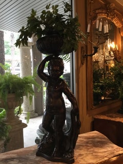 Ein Paar antiker italienischer, geschwärzter, geschnitzter Holzfiguren/Jardinières