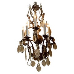 Pair of large iron and crystal five light sconces