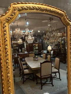 French Louis Philippe style Giltwood wall mirror with arched crest