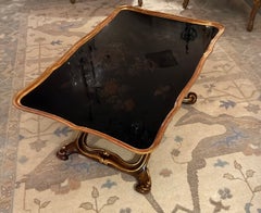 Black and gilt coffee table on X base with chinoiserie design top