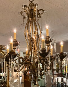 Large gilt iron and crystal chandelier with nine lights