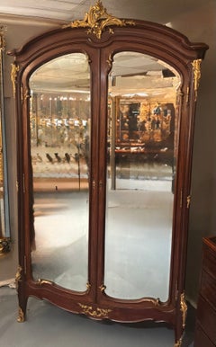 French armoire Louis XV Style with bronze dore mounts and beveled mirror doors